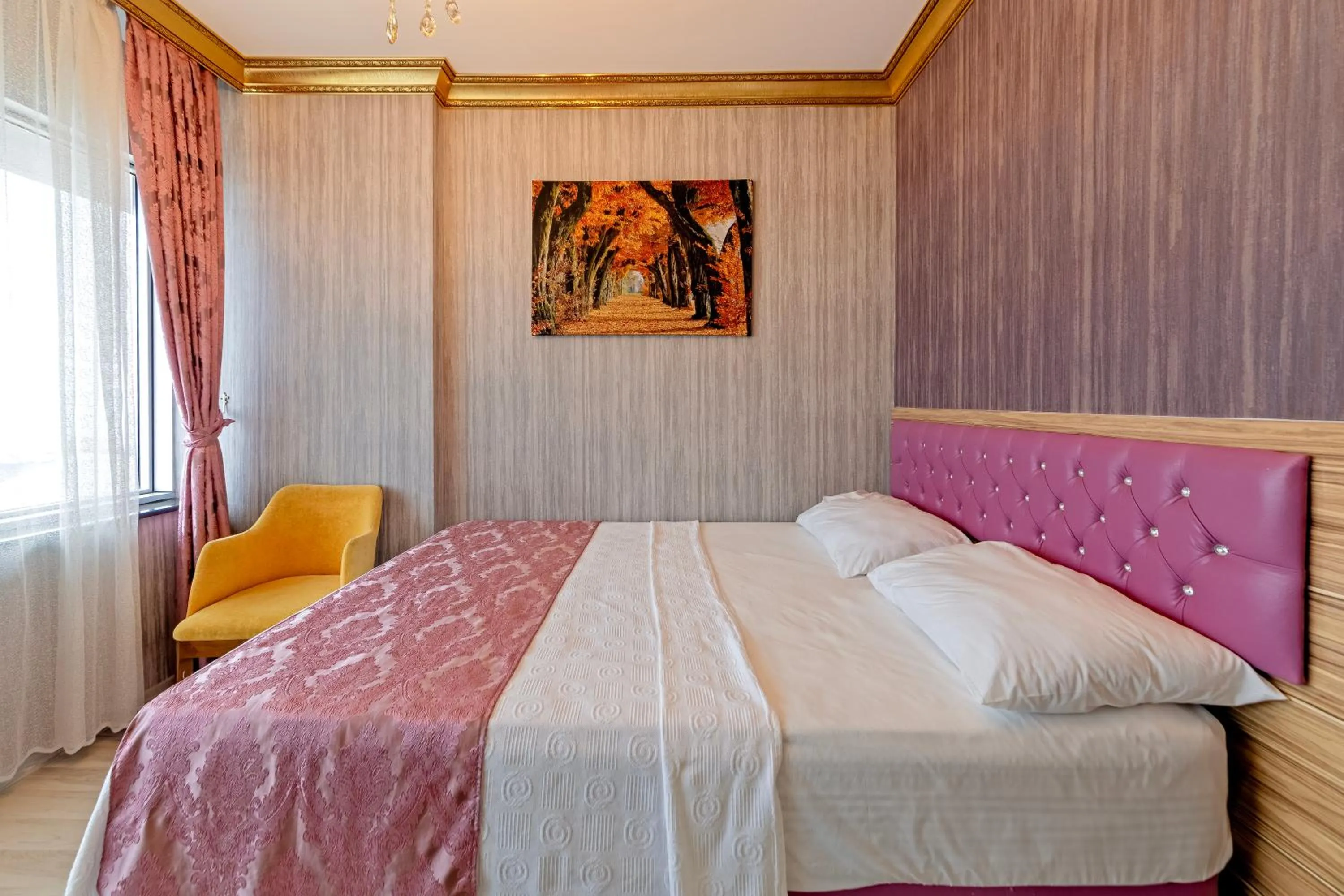 Bed in Royal Babil Suites Hotel