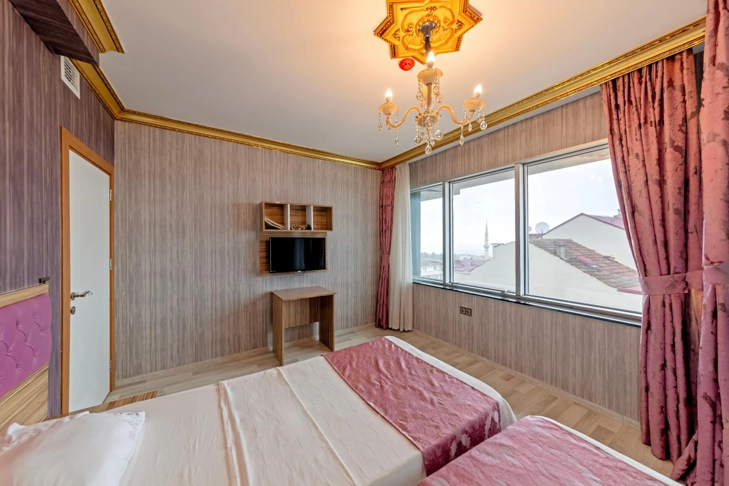 Bed in Royal Babil Suites Hotel