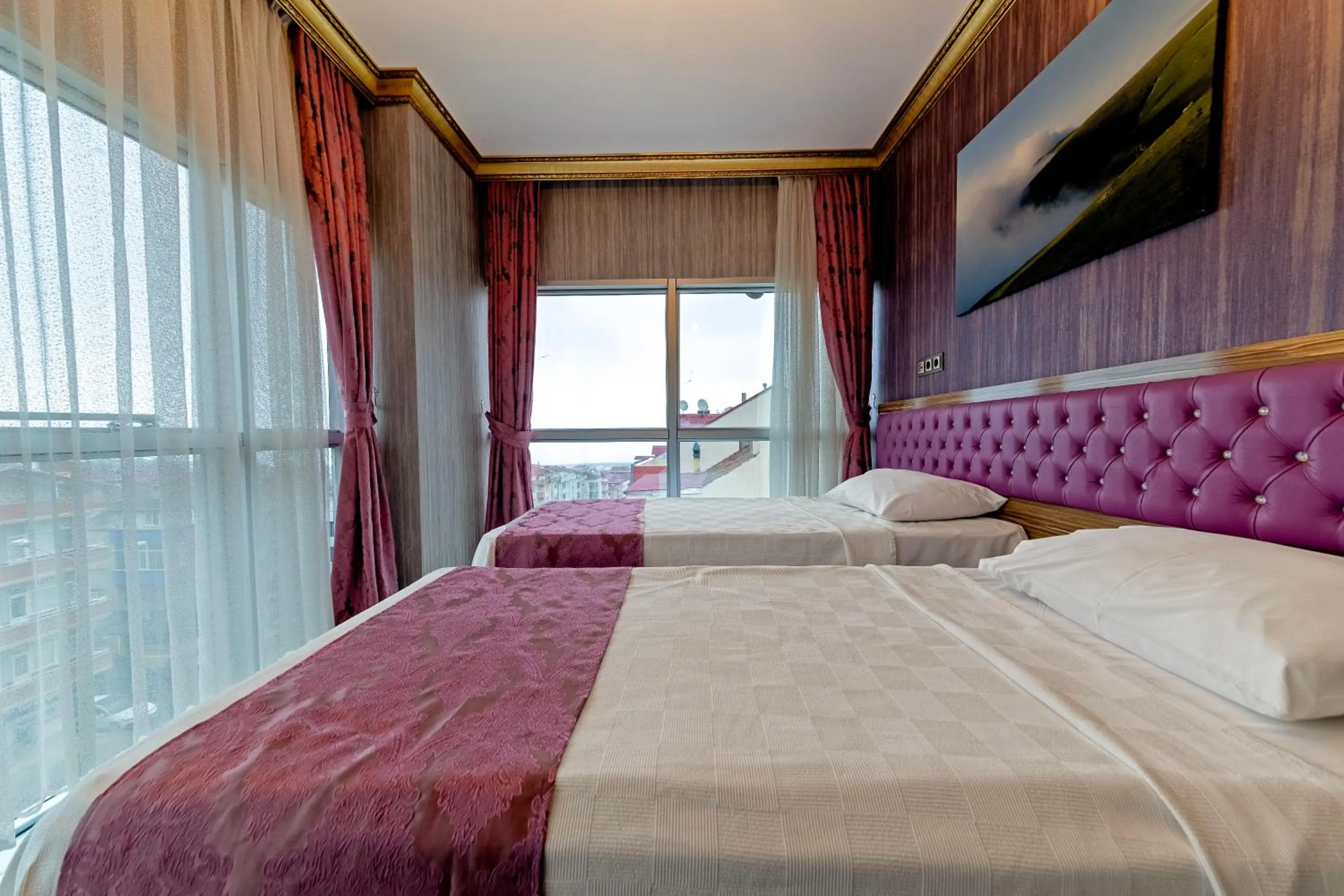 Bed in Royal Babil Suites Hotel