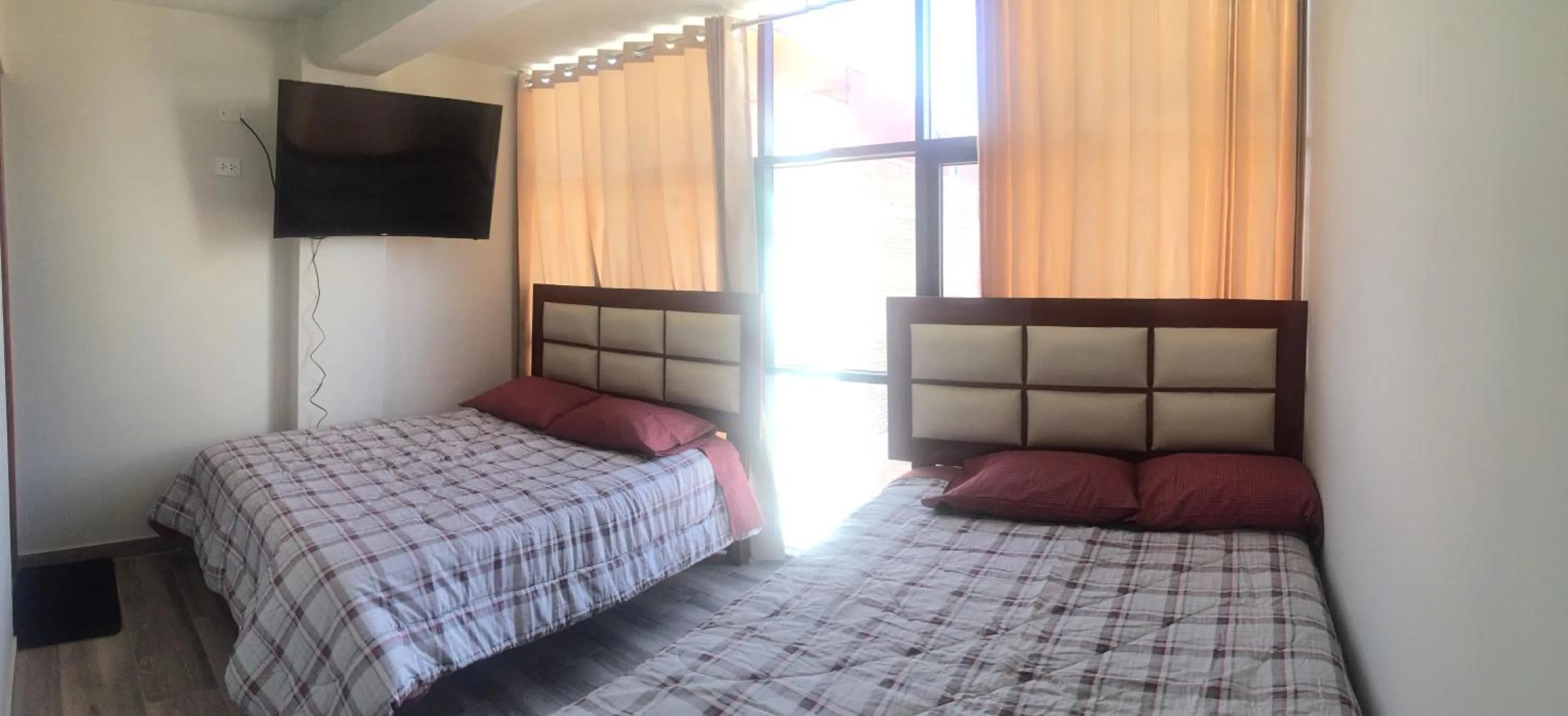 Bed in A-Hope Suite Hotel