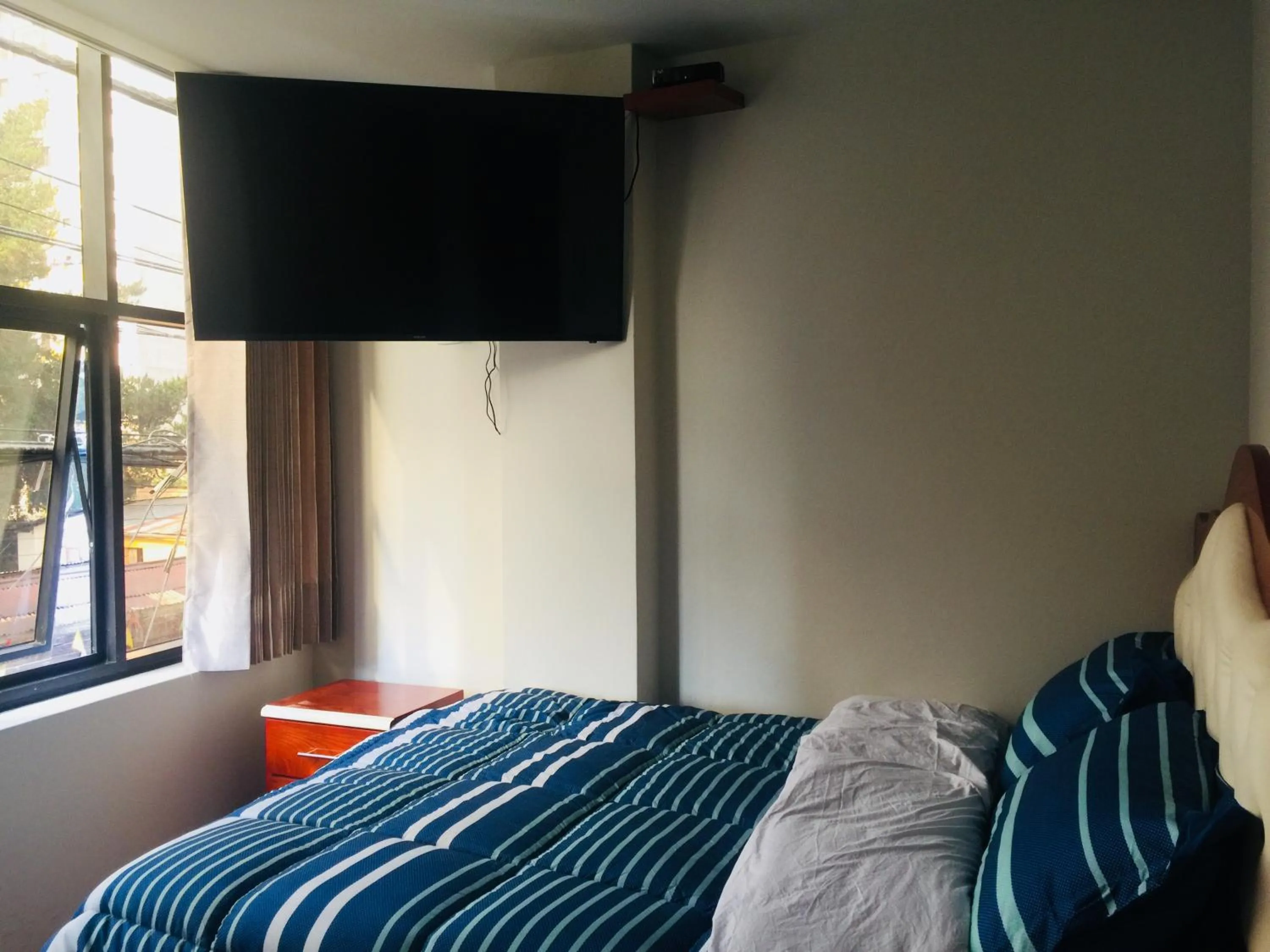 Bed in A-Hope Suite Hotel