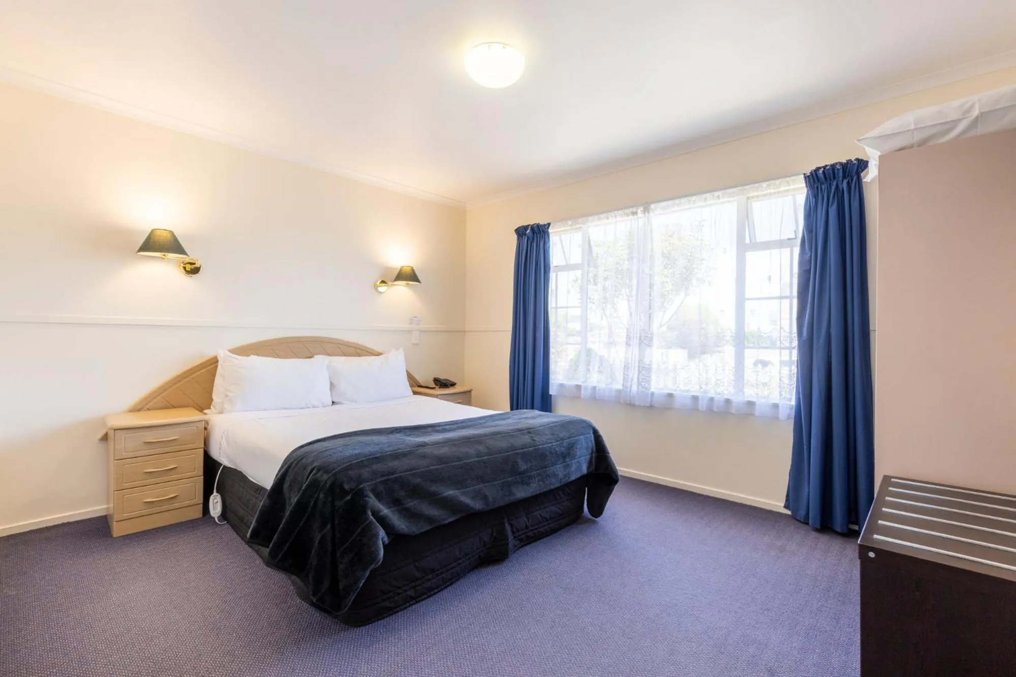 Bed in ASURE PRINCE motor lodge