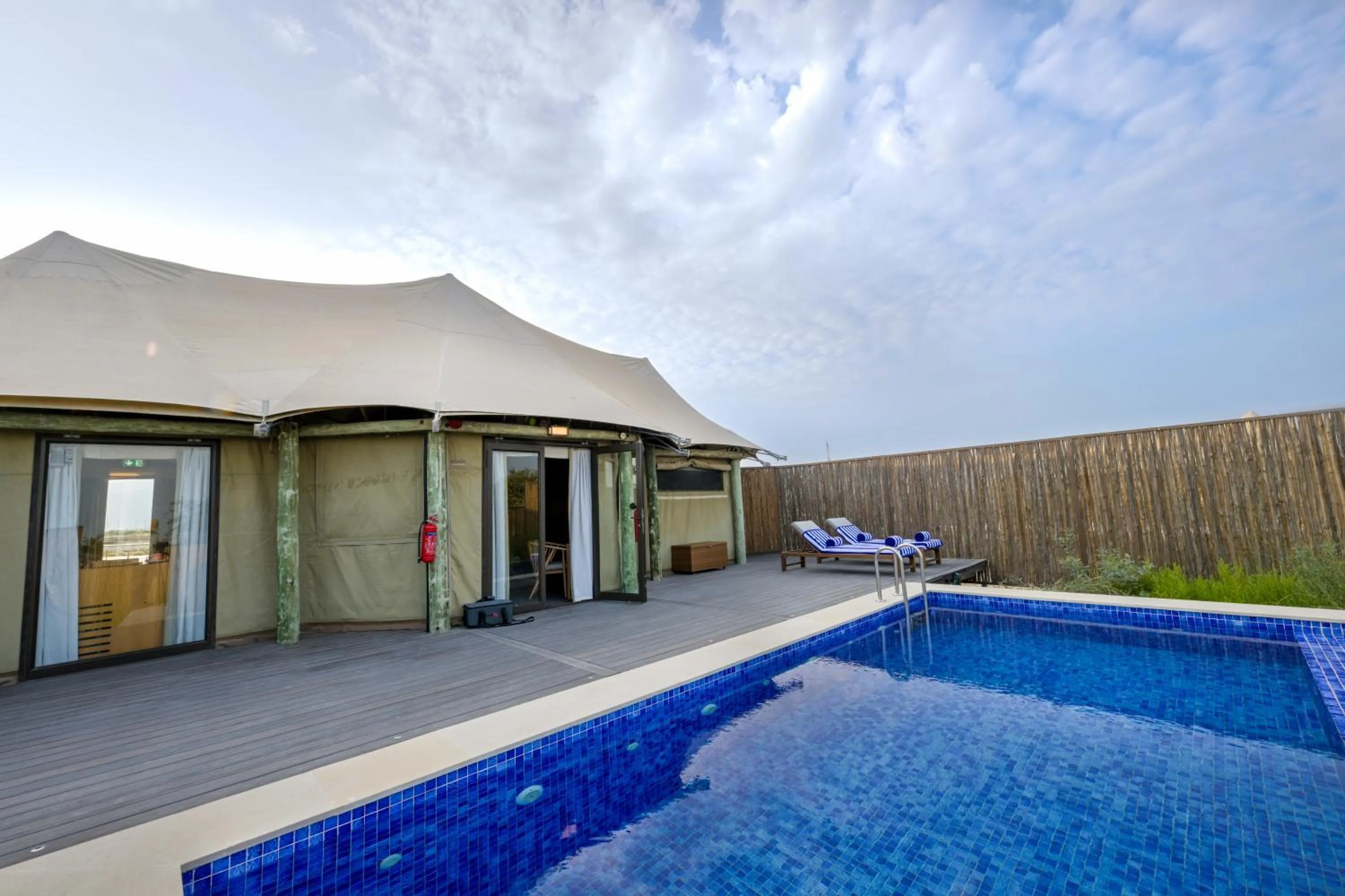 Swimming pool in Kingfisher Retreat by Sharjah Collection