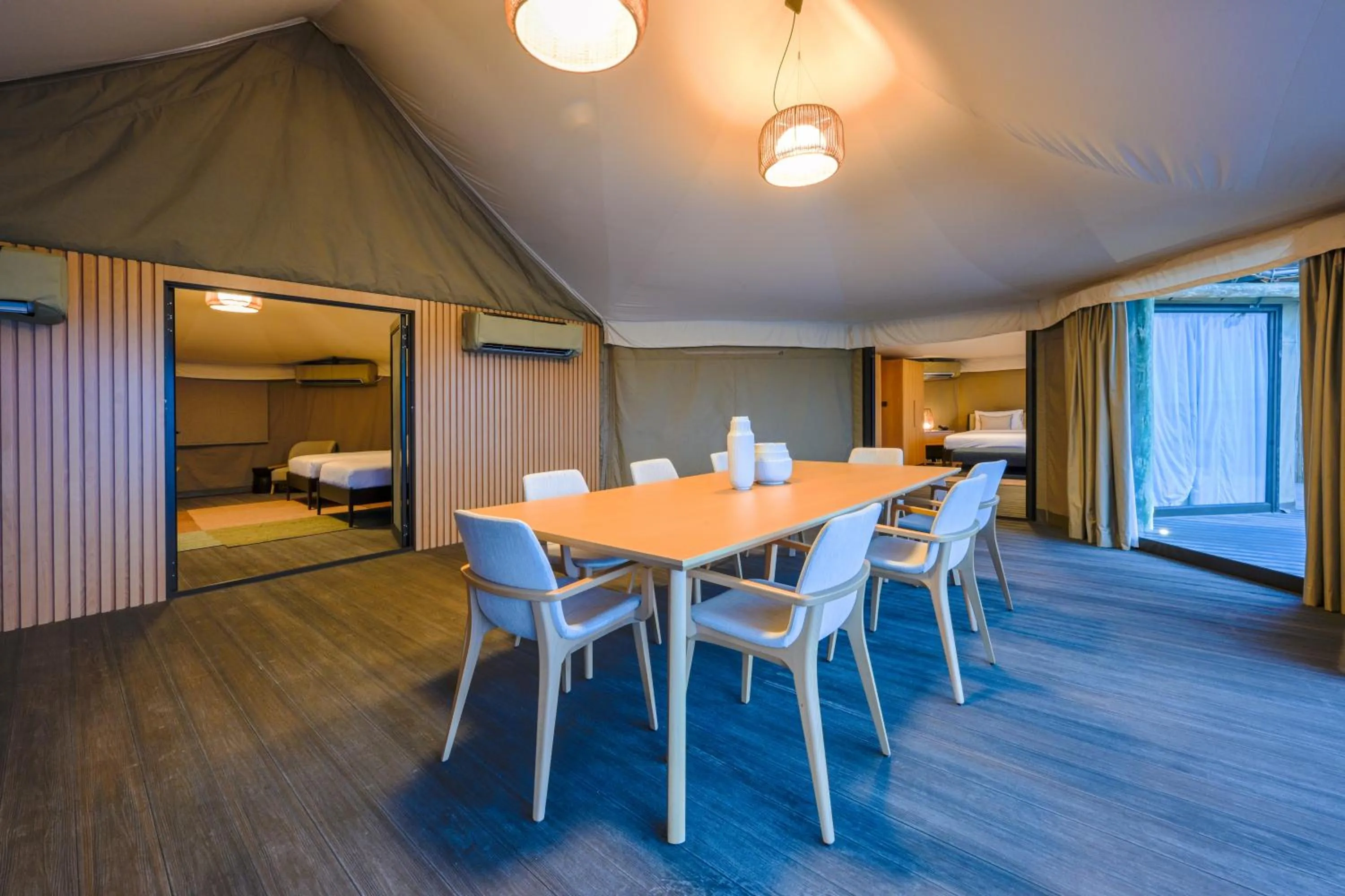 Dining area, Bed in Kingfisher Retreat by Sharjah Collection