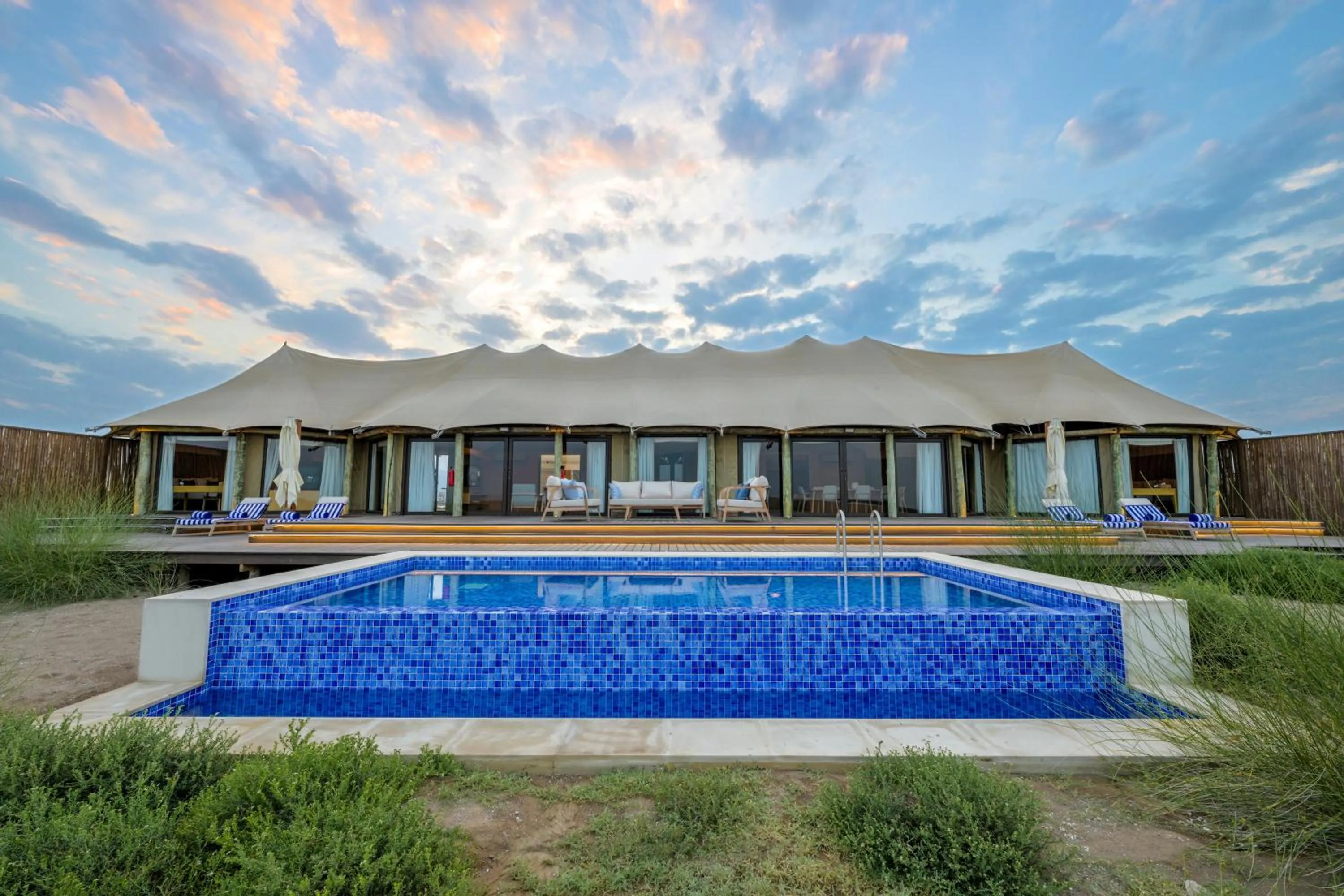 Pool view in Kingfisher Retreat by Sharjah Collection