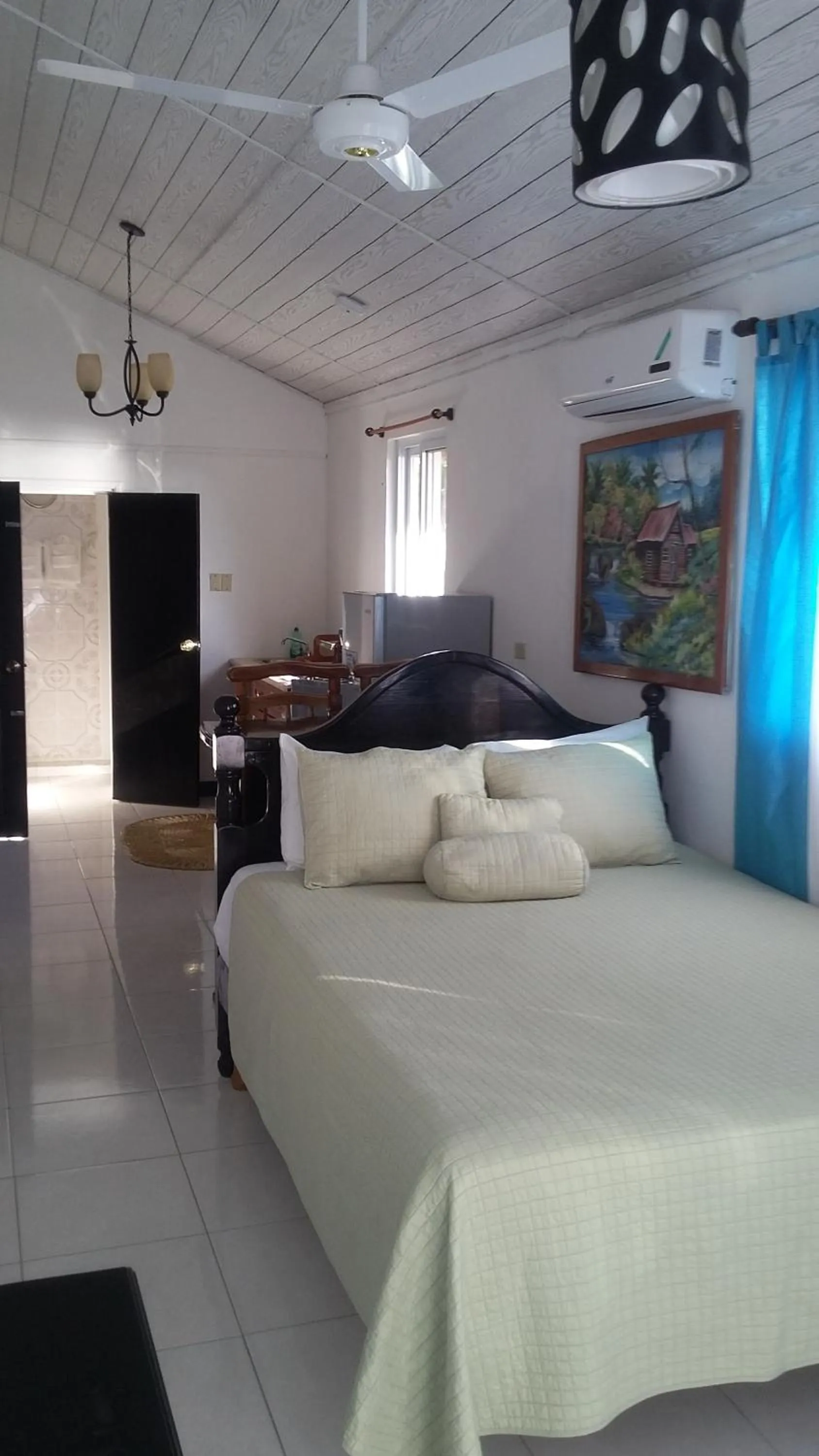 Bed in Firefly Beach Cottages