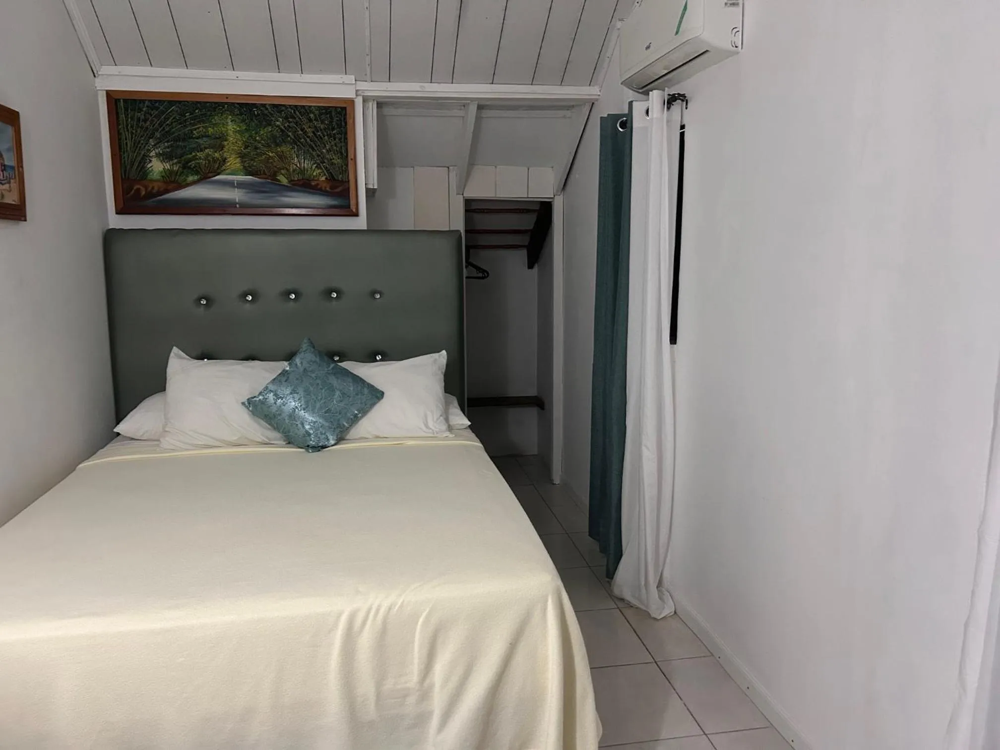 Bed in Firefly Beach Cottages