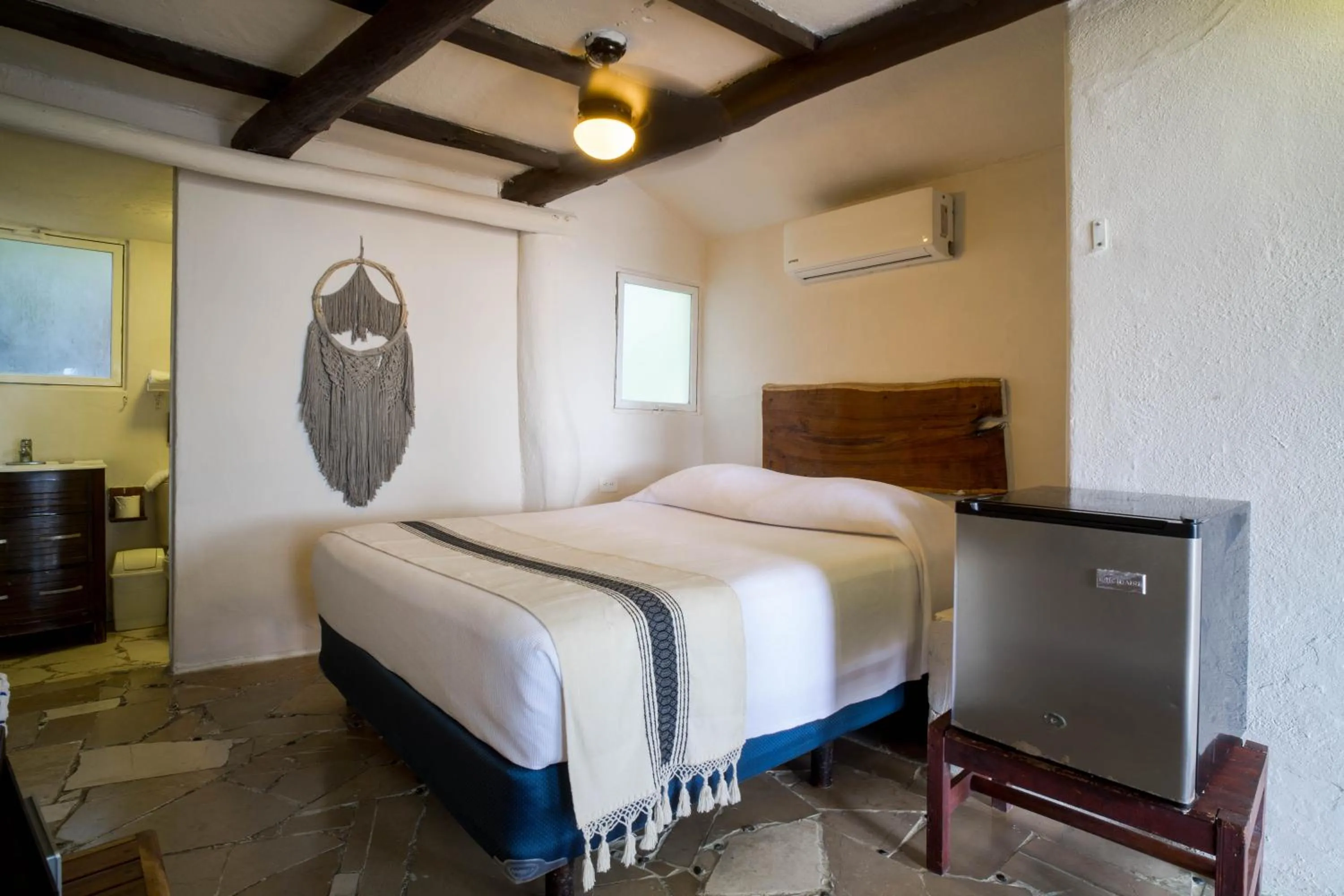 Bed in BT Live Tulum located at the party zone