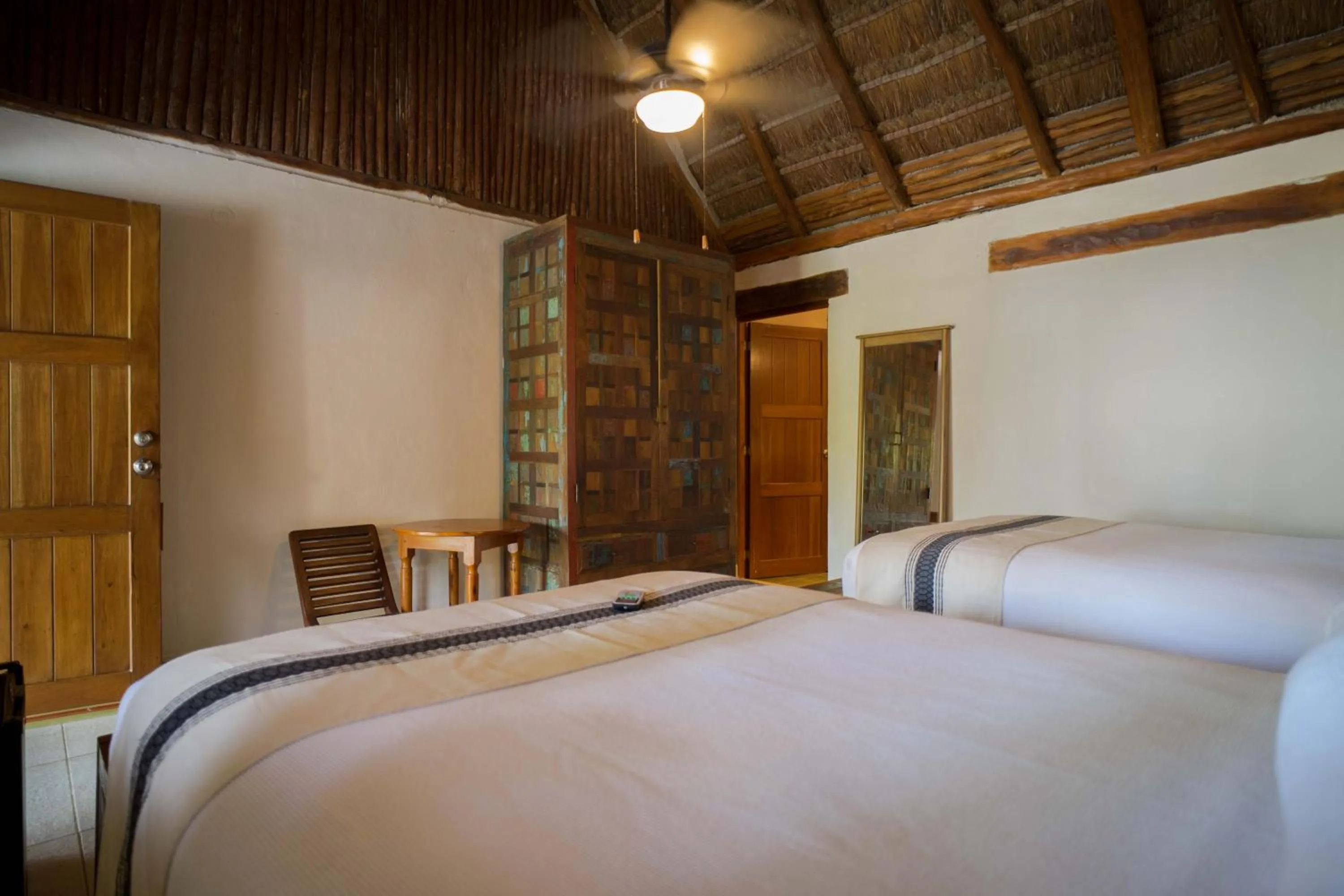 Bed in BT Live Tulum located at the party zone