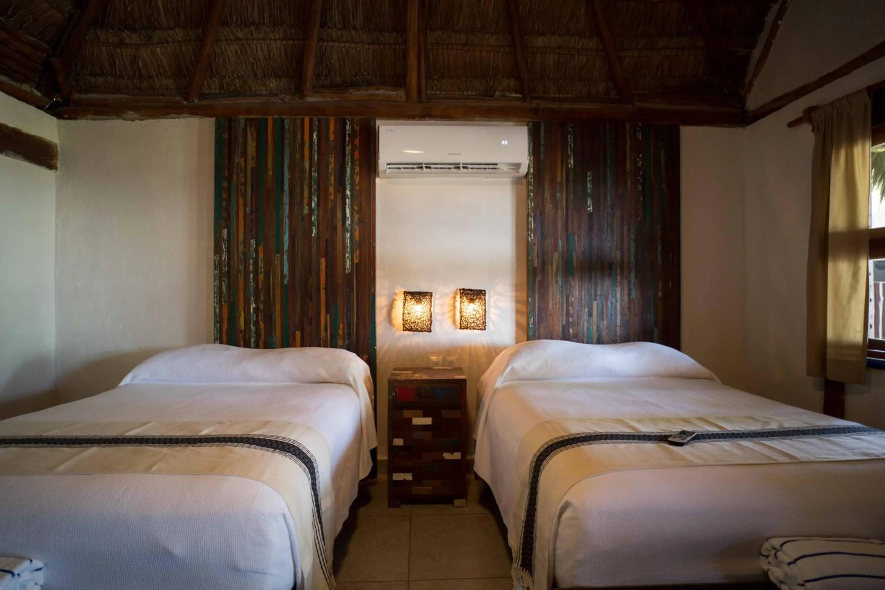 Bed in BT Live Tulum located at the party zone