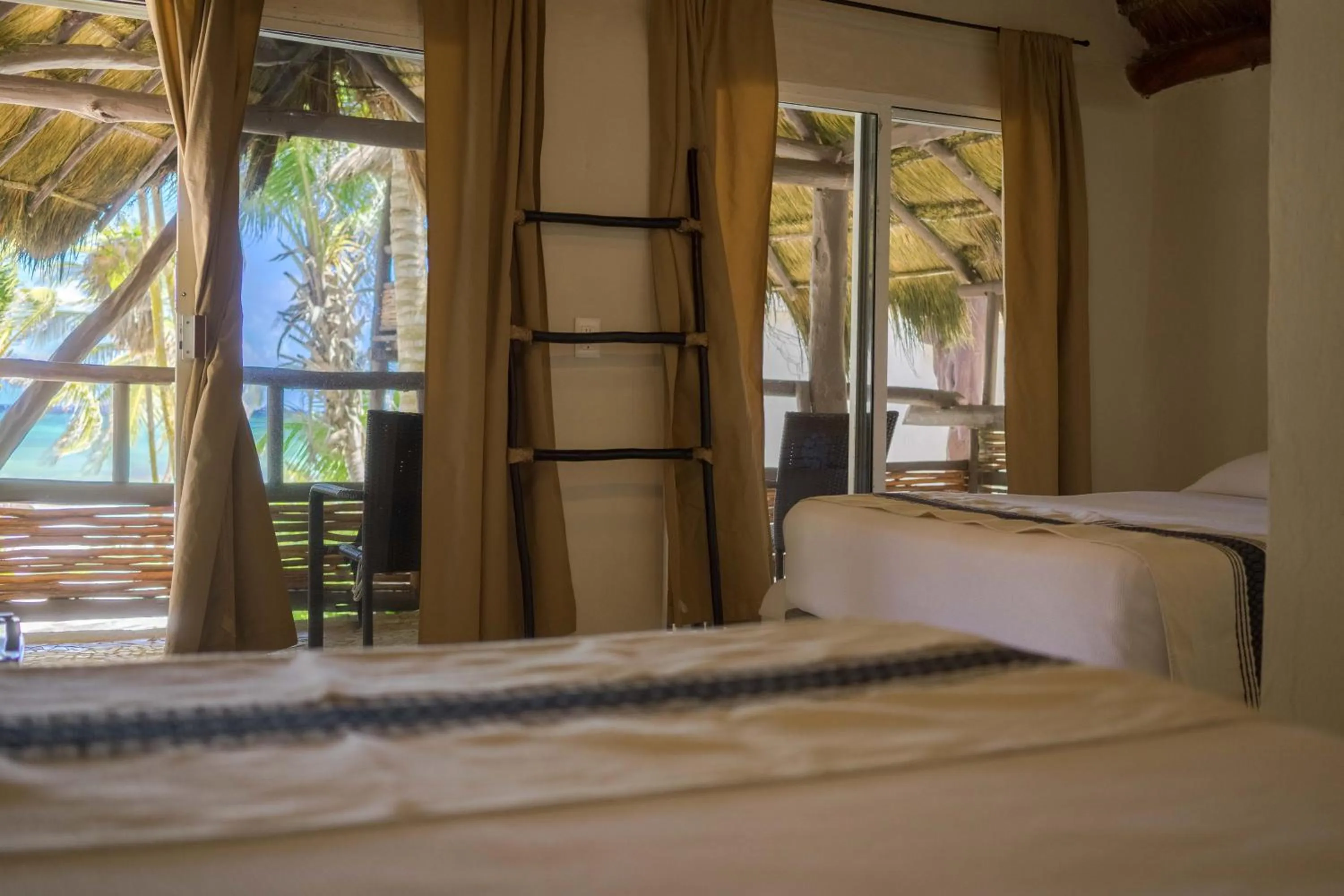 Bed in BT Live Tulum located at the party zone