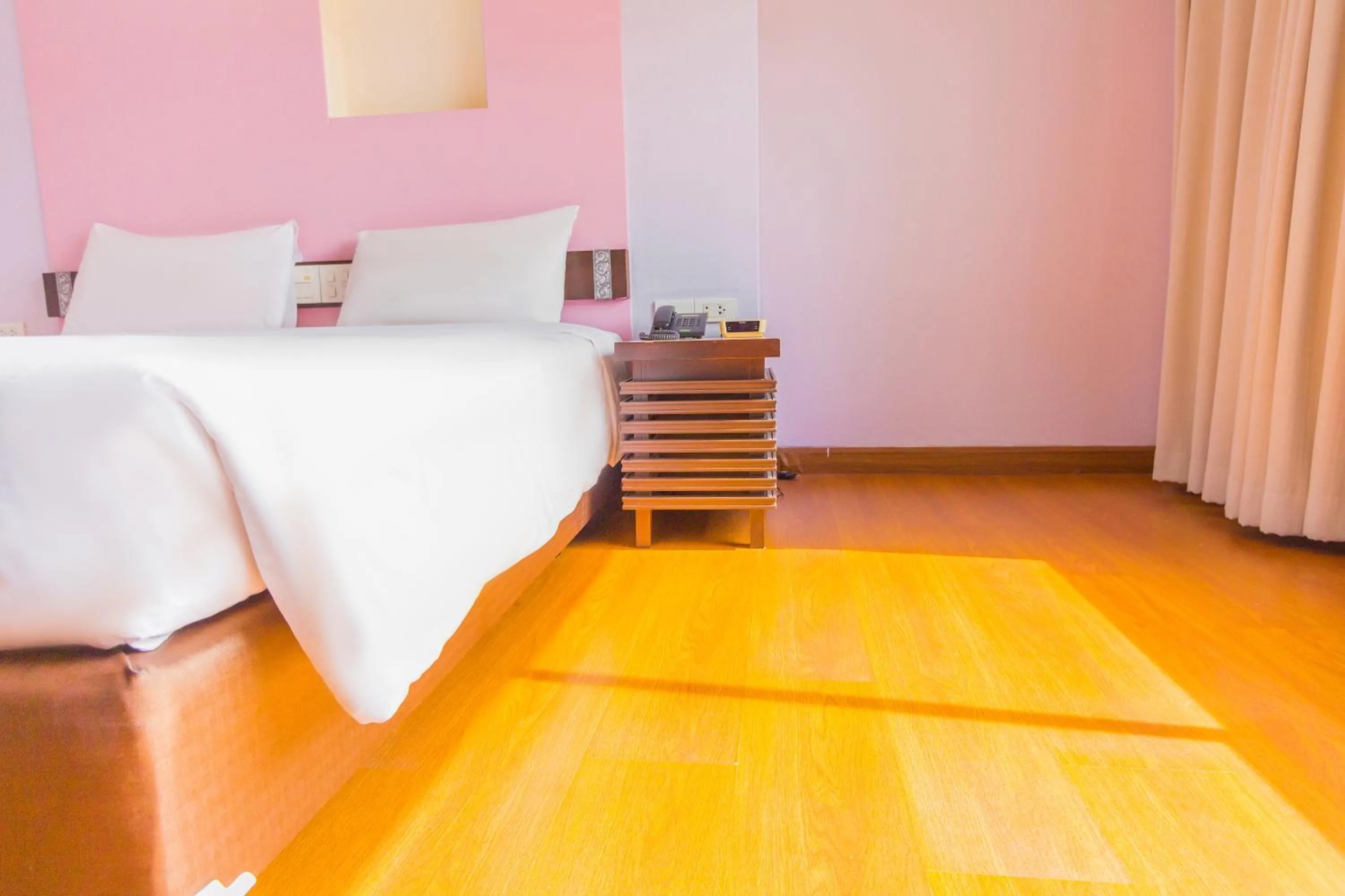 Bed in Mayflower Grande Chiang Mai