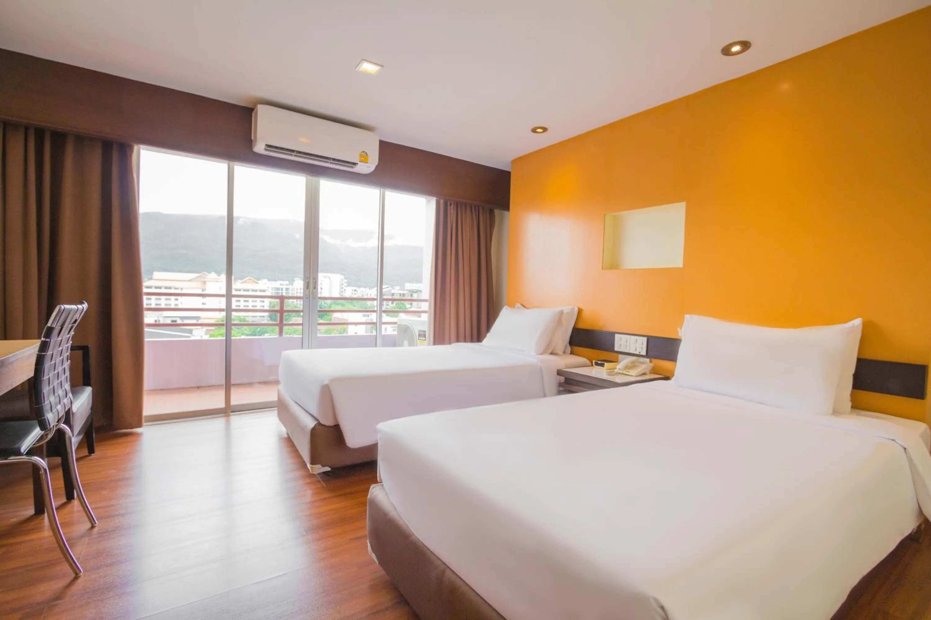 Bed in Mayflower Grande Chiang Mai