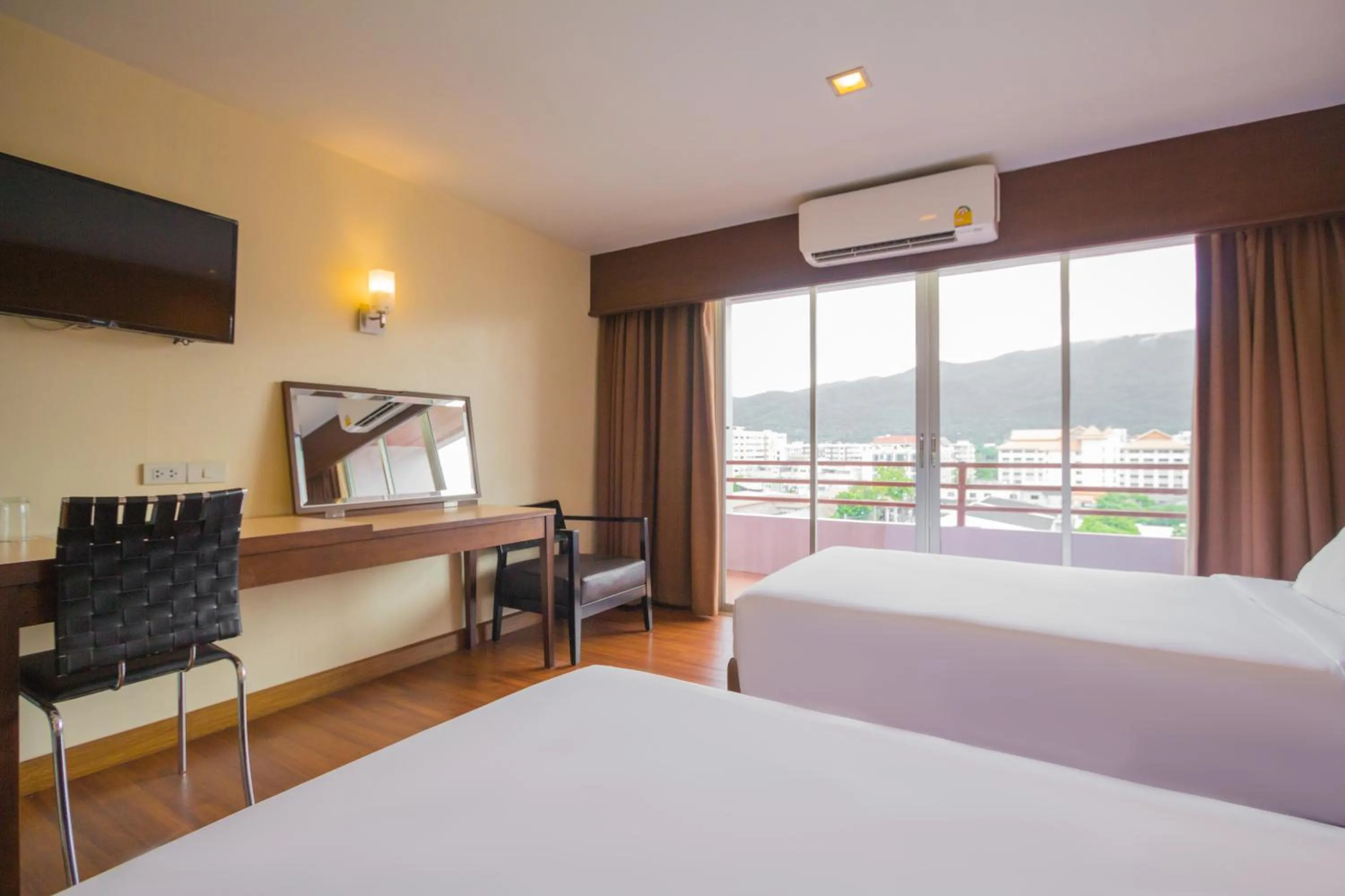 Bed in Mayflower Grande Chiang Mai
