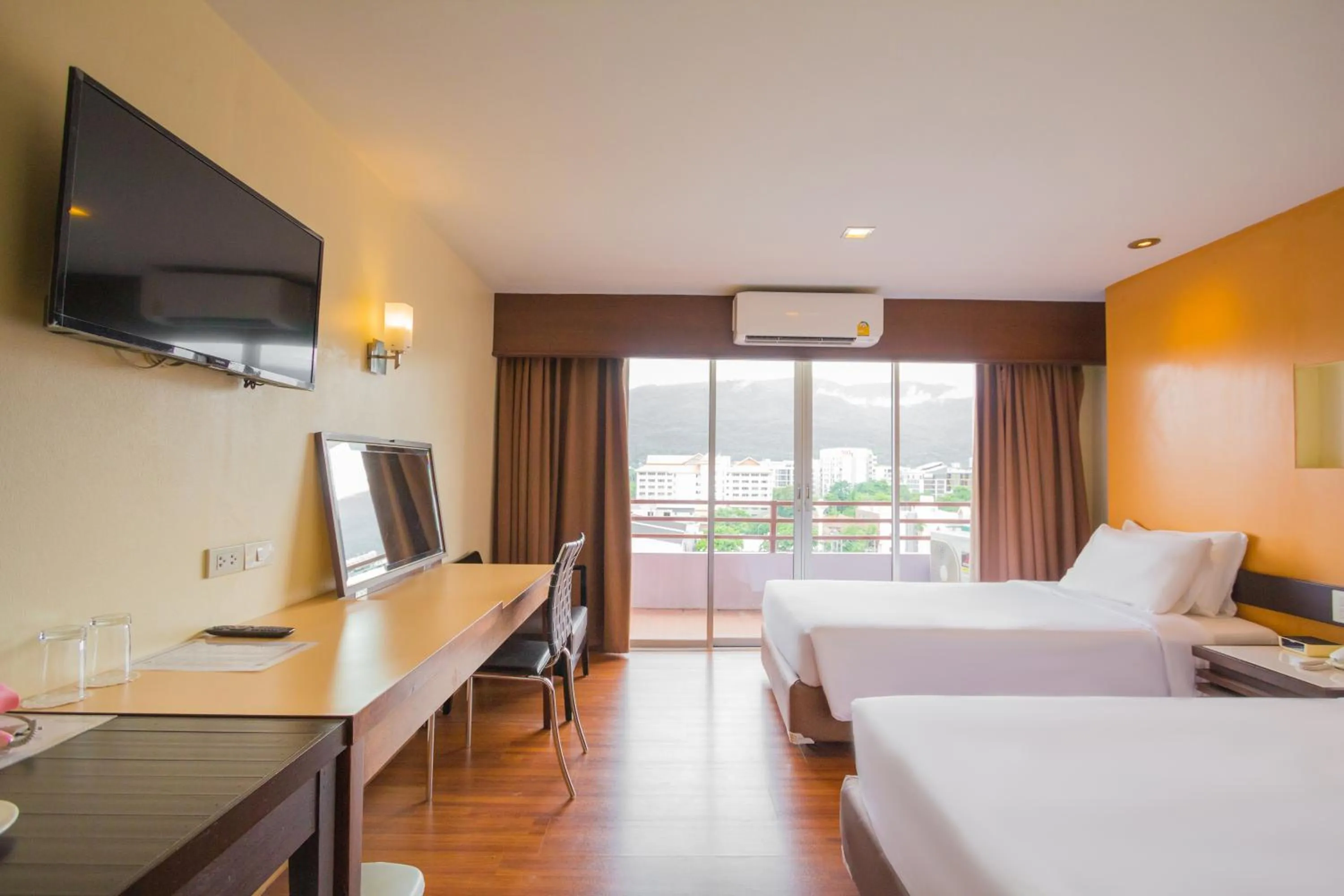 Bed in Mayflower Grande Chiang Mai