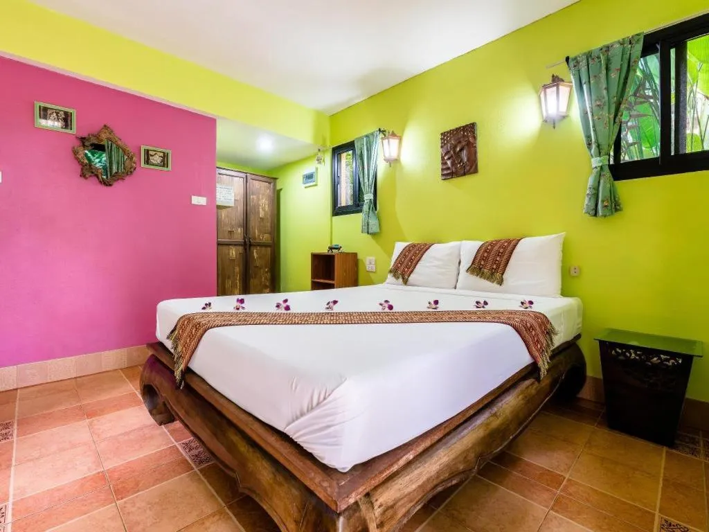 Bed in Chez Charly Bungalow