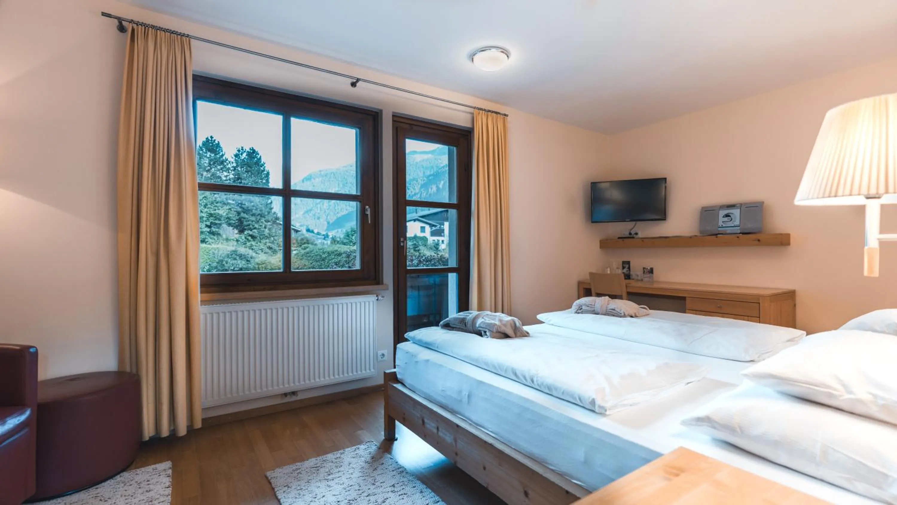 Photo of the whole room, Bed in Felbermayer Hotel & AlpineSpa-Montafon