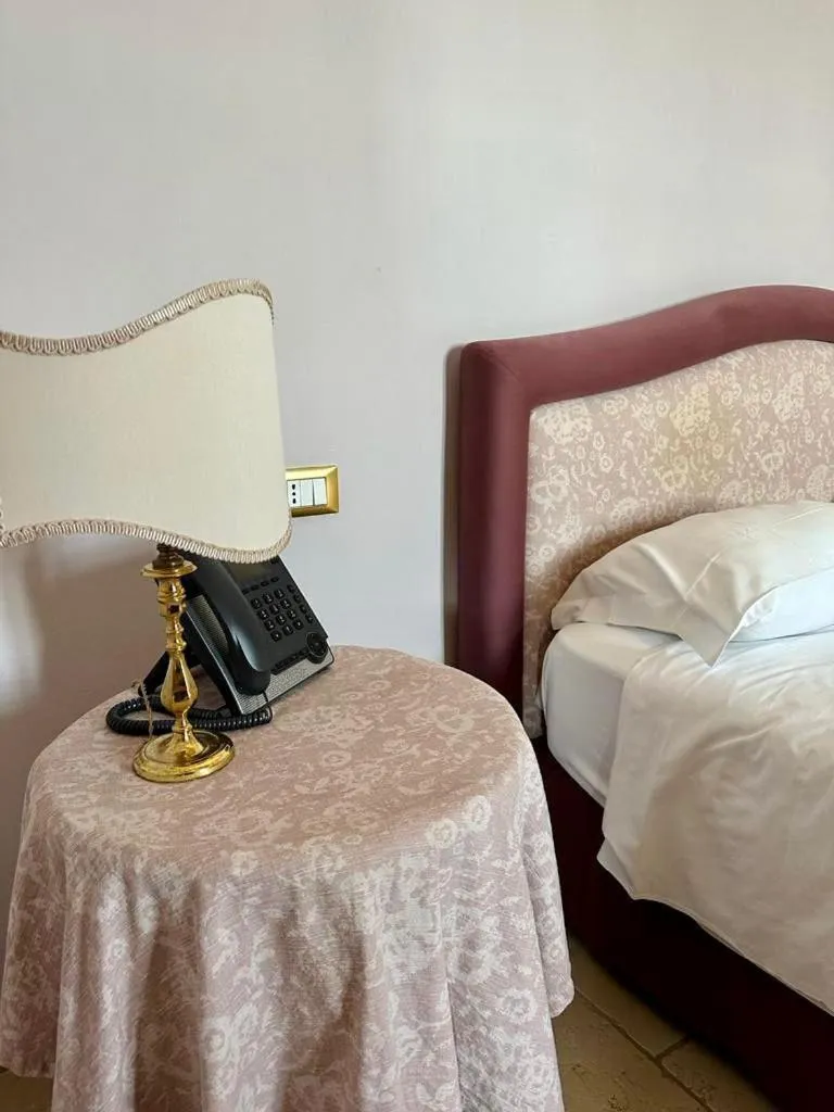 Bed in Hotel Saraceno Al Faro