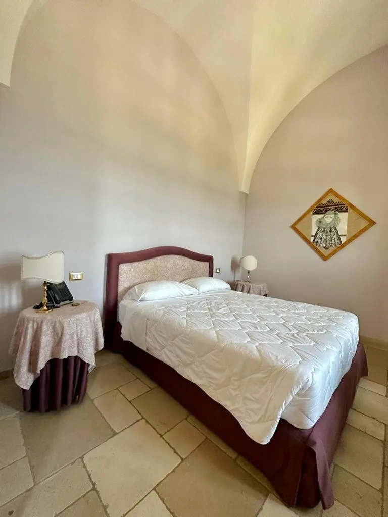 Bed in Hotel Saraceno Al Faro
