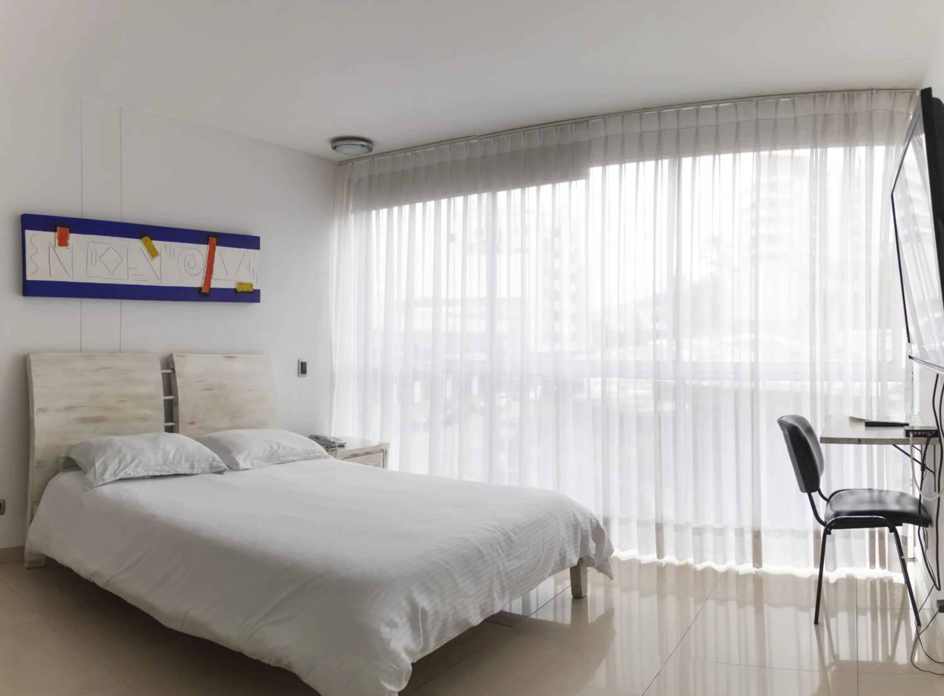 Bed in Monterosa Apartamentos Amoblados