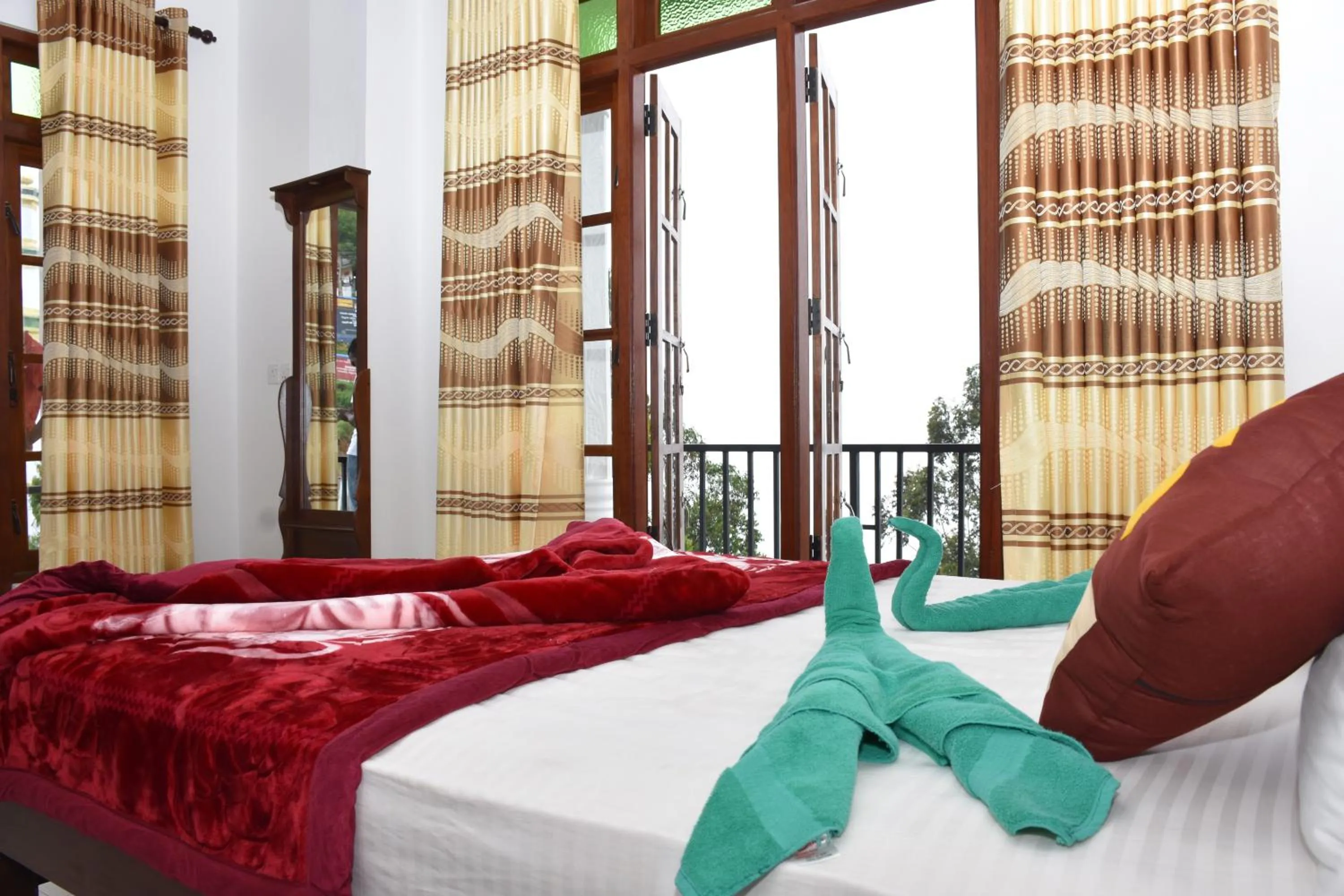 Bed in Grand View Guest House