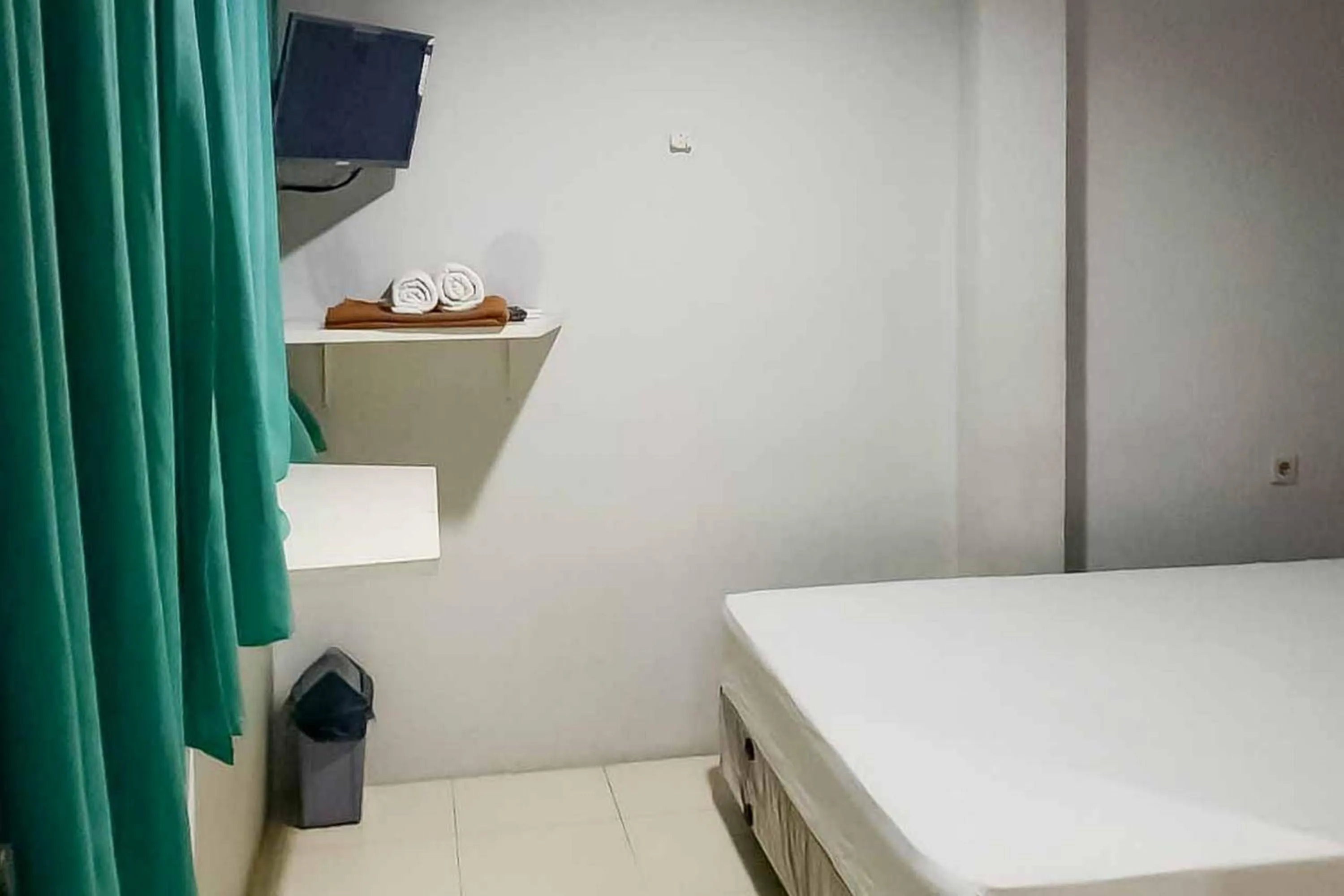 Bed in Rumahku Hayam Wuruk Mitra RedDoorz
