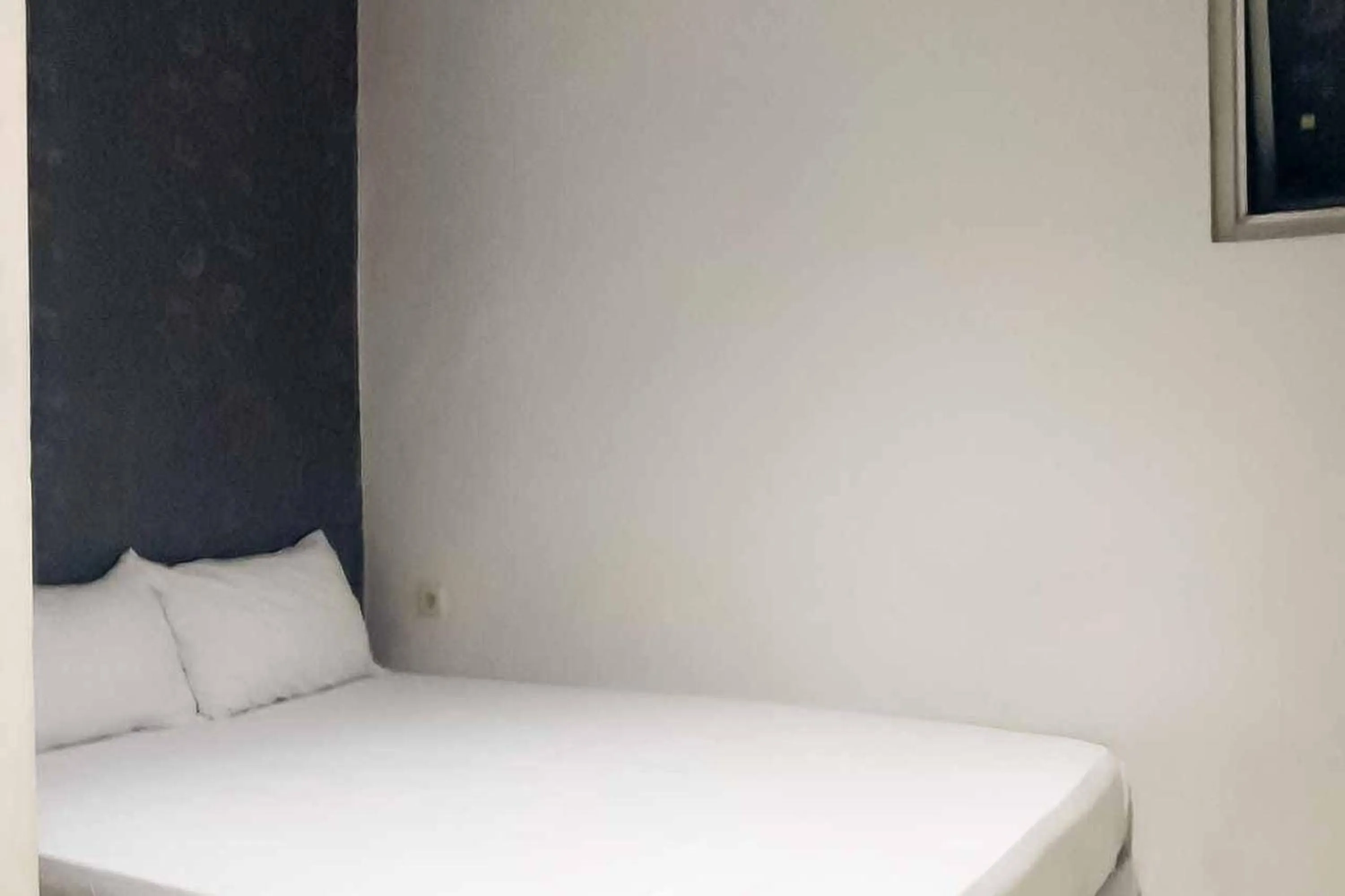 Bed in Rumahku Hayam Wuruk Mitra RedDoorz