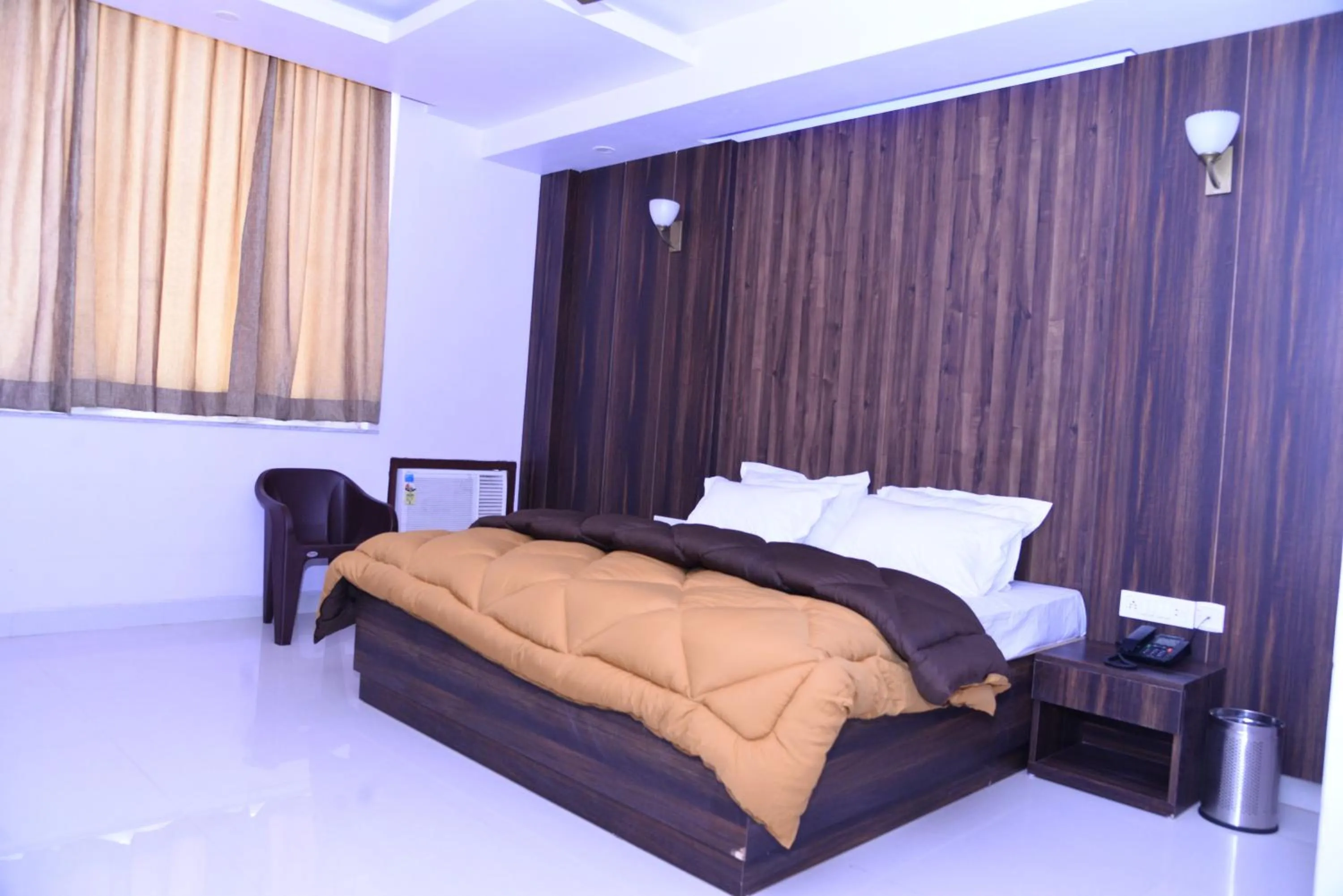 Bed in The Ravindram Hotel