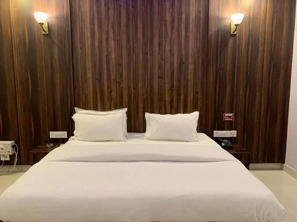 Bed in The Ravindram Hotel