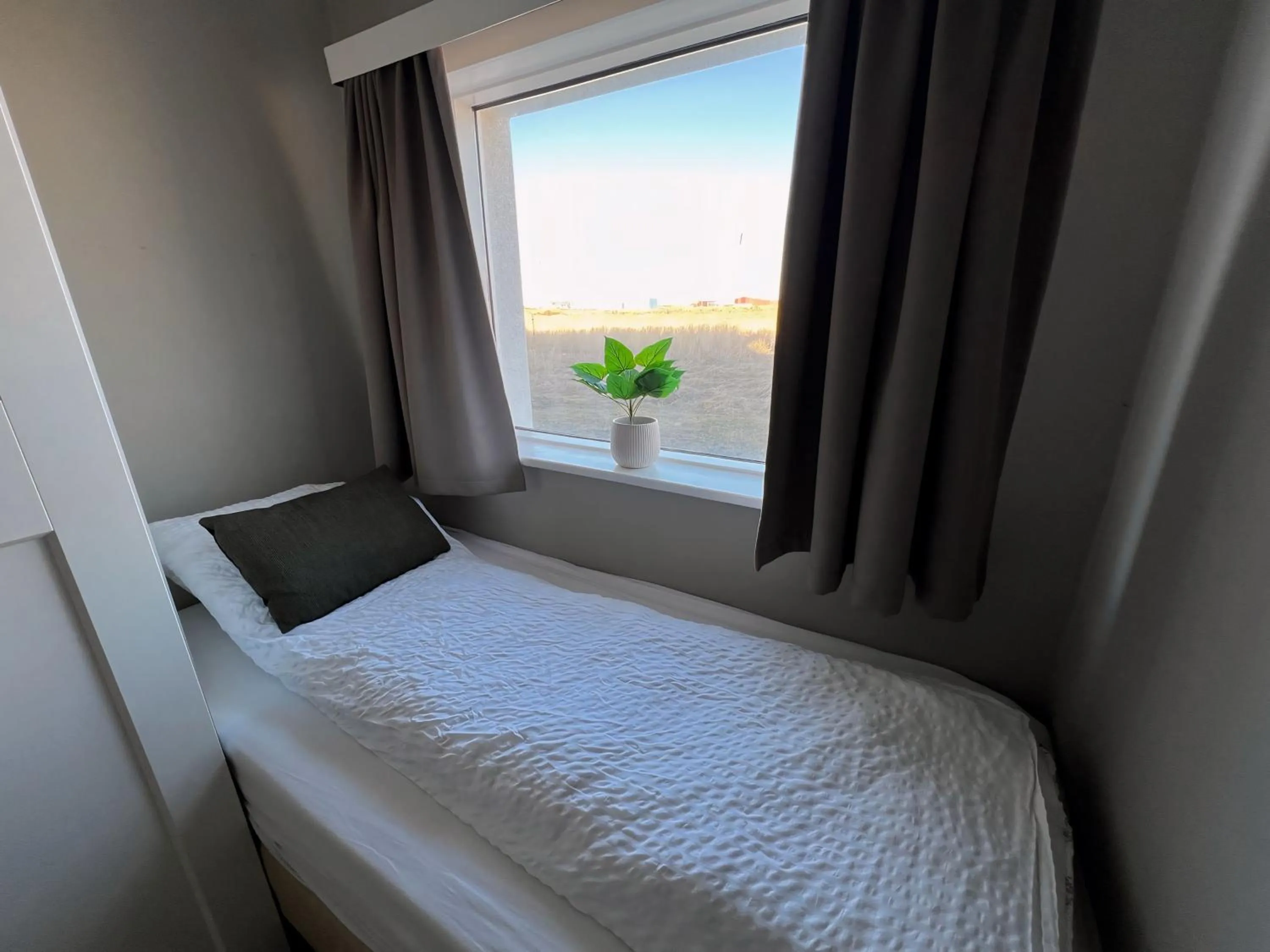 Bed in Garður Apartments