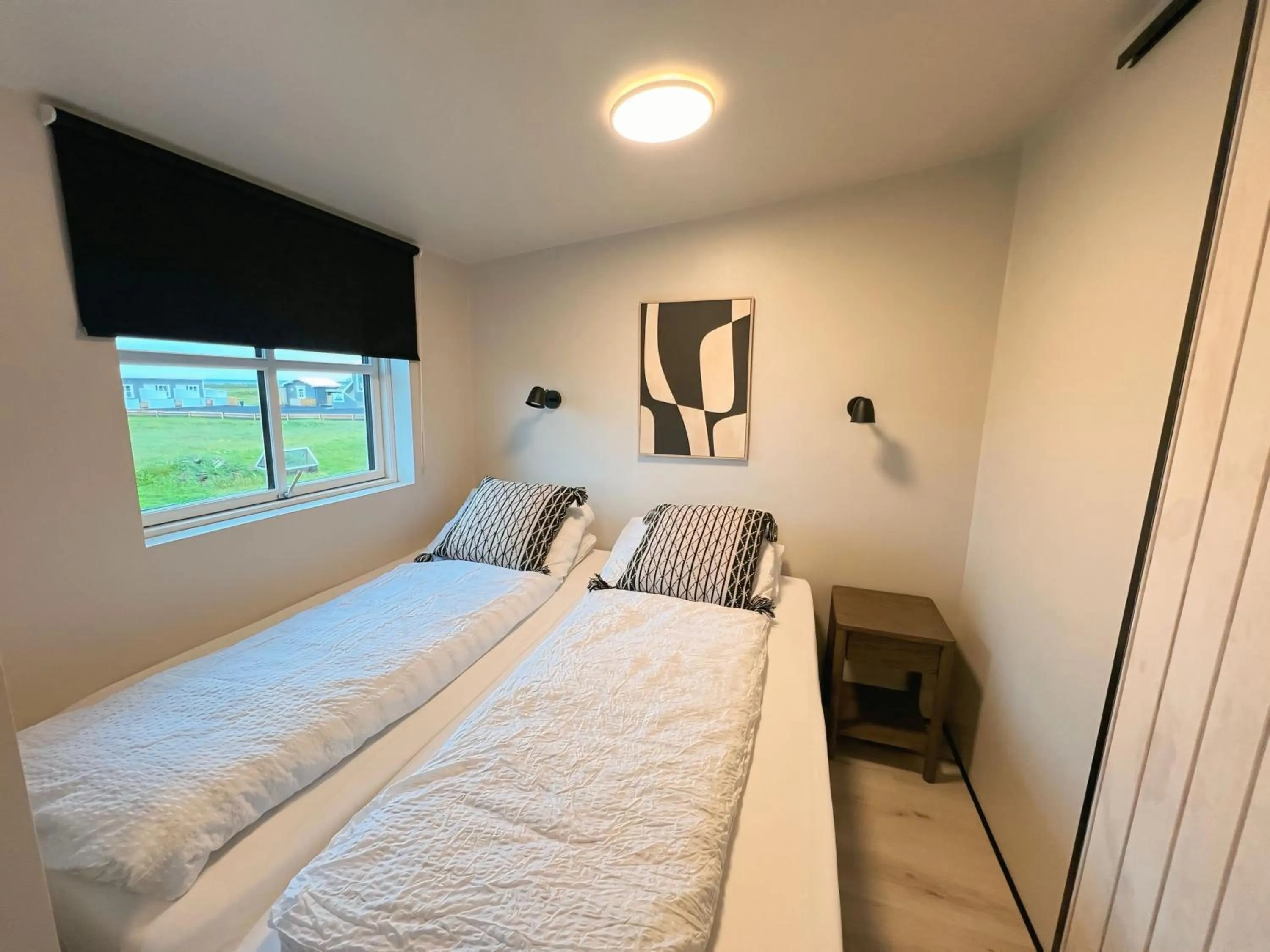 Bed in Garður Apartments