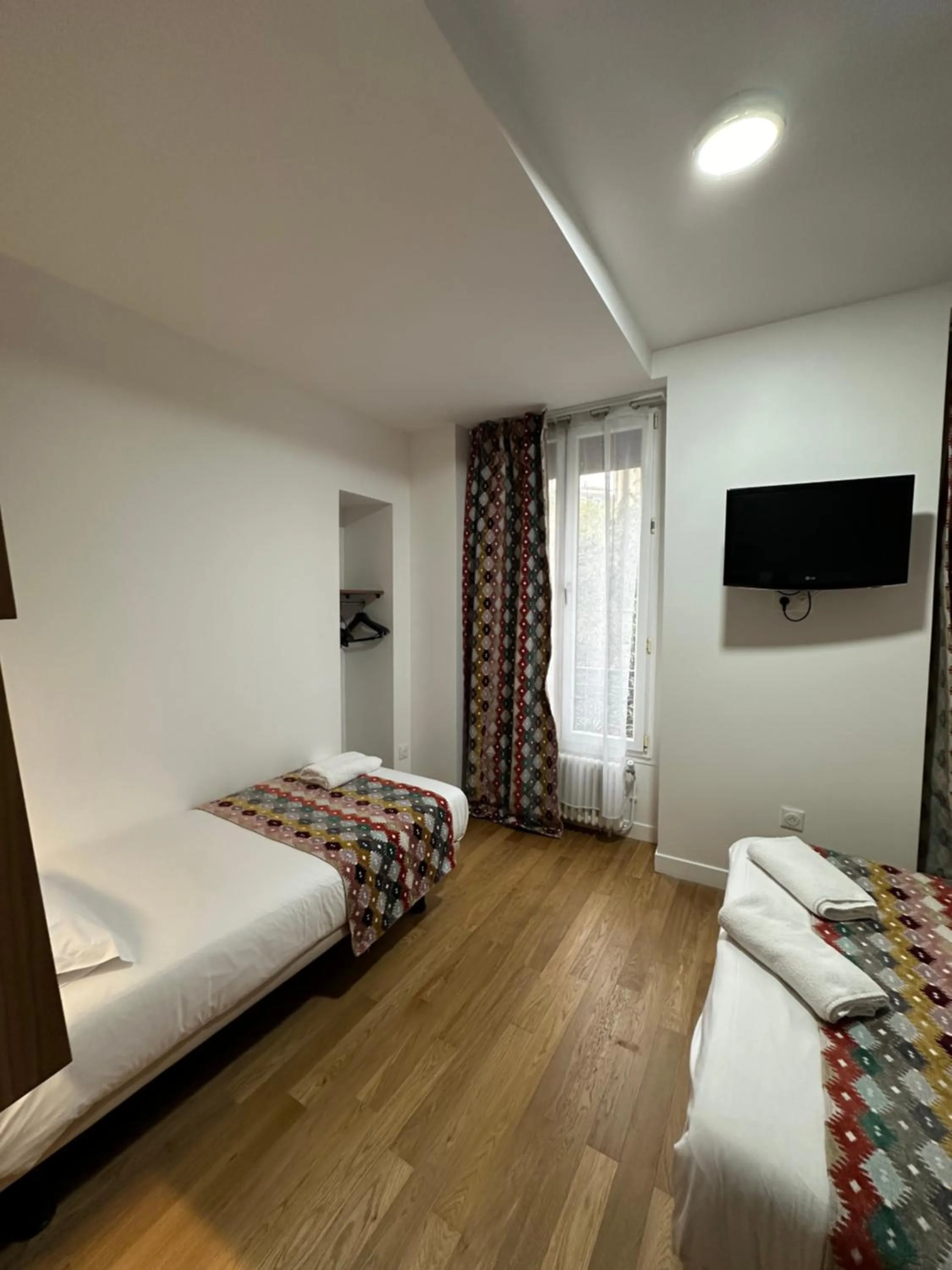 Bed in Hotel Paris Bruxelles