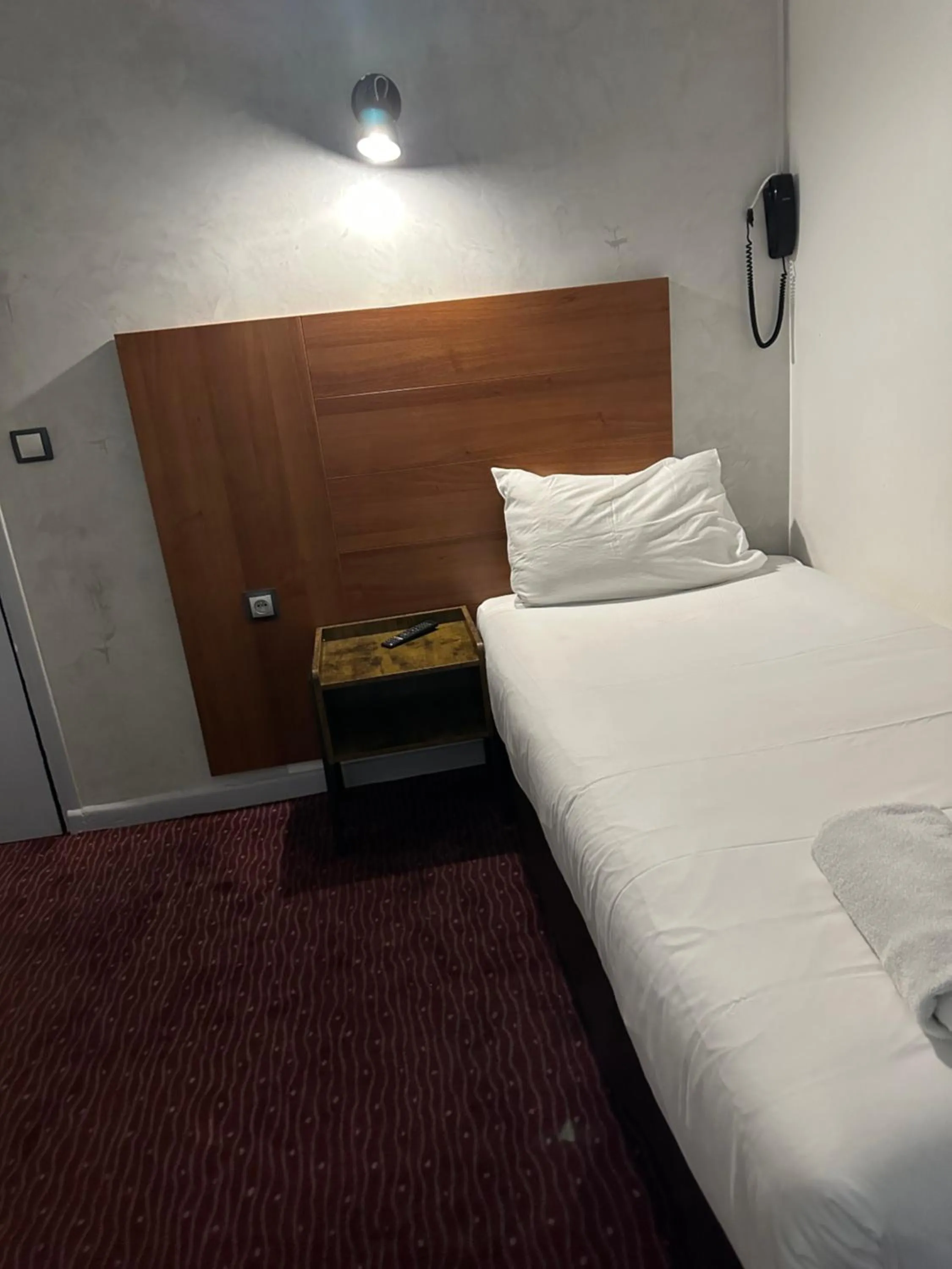 Bed in Hotel Paris Bruxelles