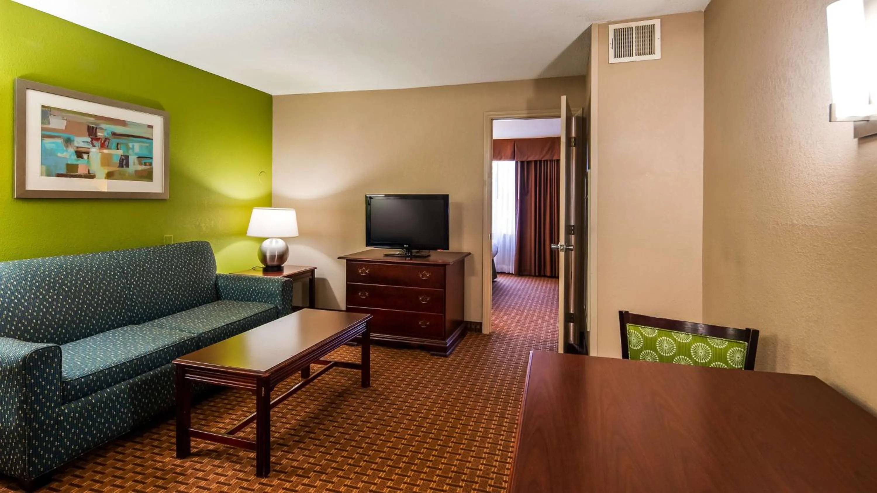 Photo of the whole room, TV/Entertainment Center in SureStay Plus Hotel by Best Western Raleigh North Downtown