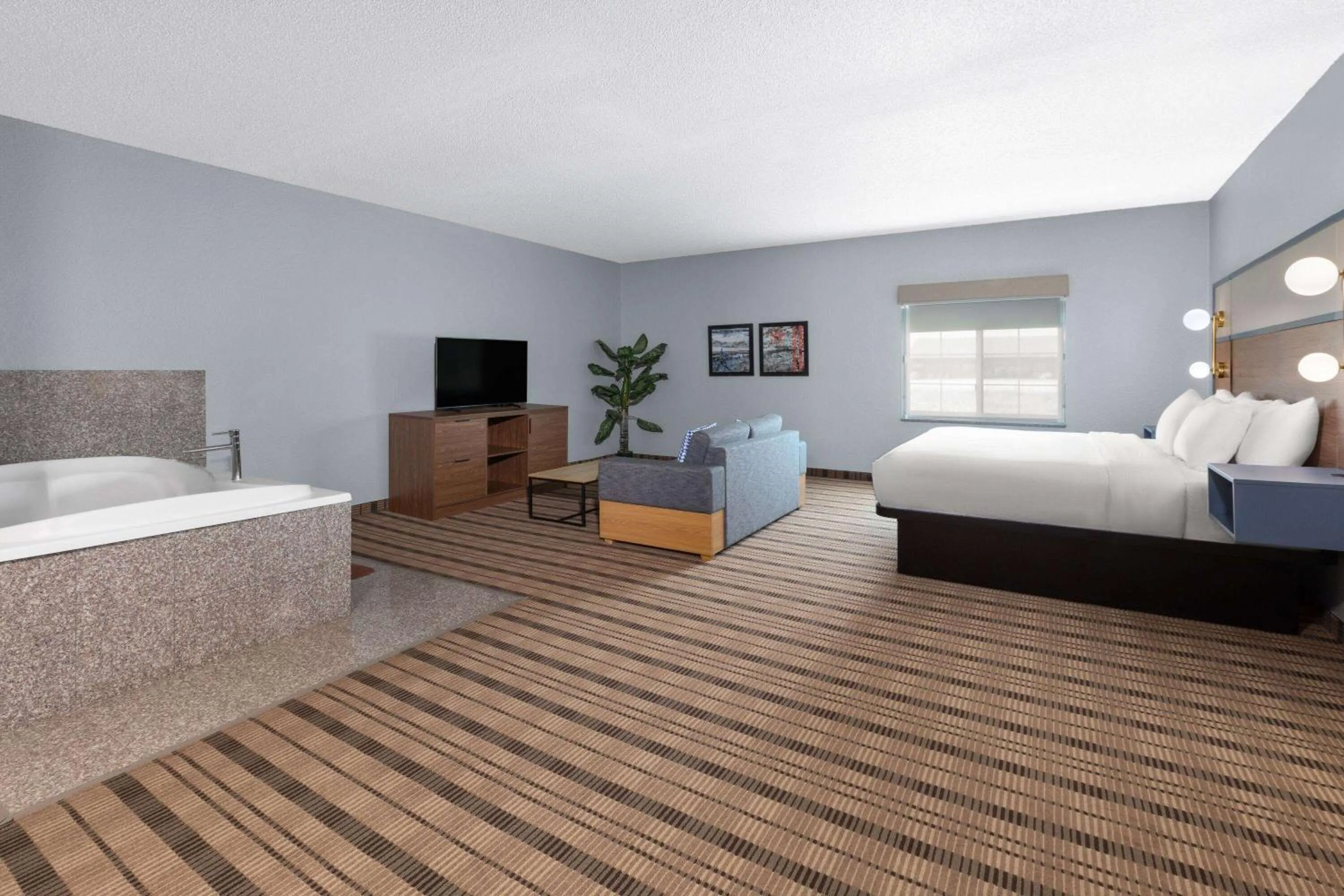 Bath, Bed in AmericInn by Wyndham Grinnell