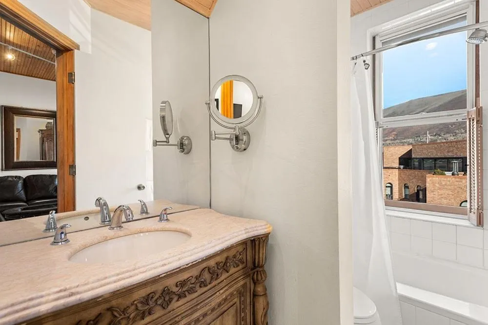 Bathroom in Independence Square Unit 306, Hotel Room with Large Sitting Area & Wet Bar