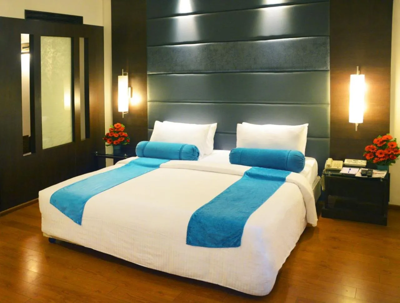 Bed in Ashraya International Hotel
