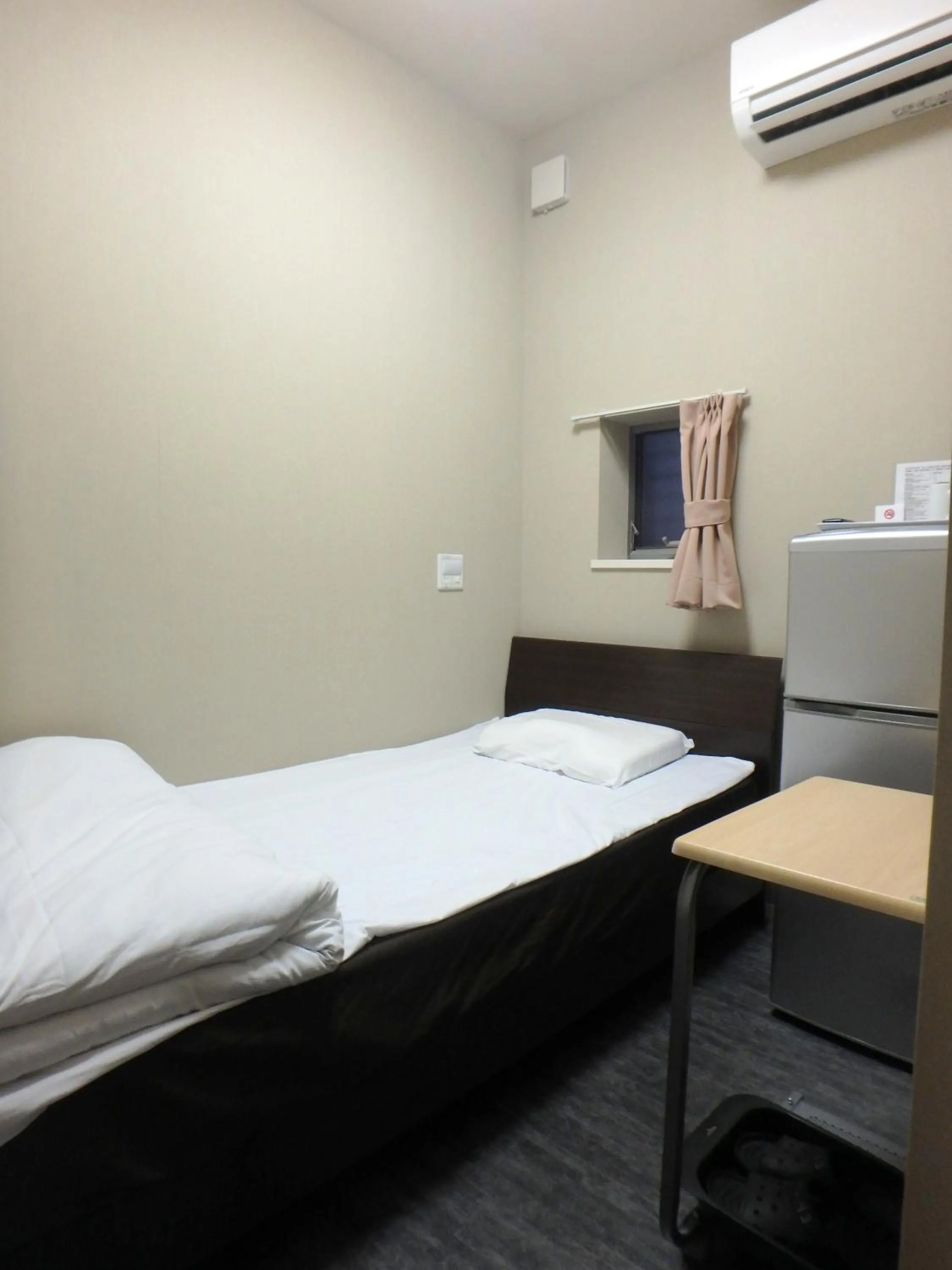 Bed in Economy Hotel Hoteiya