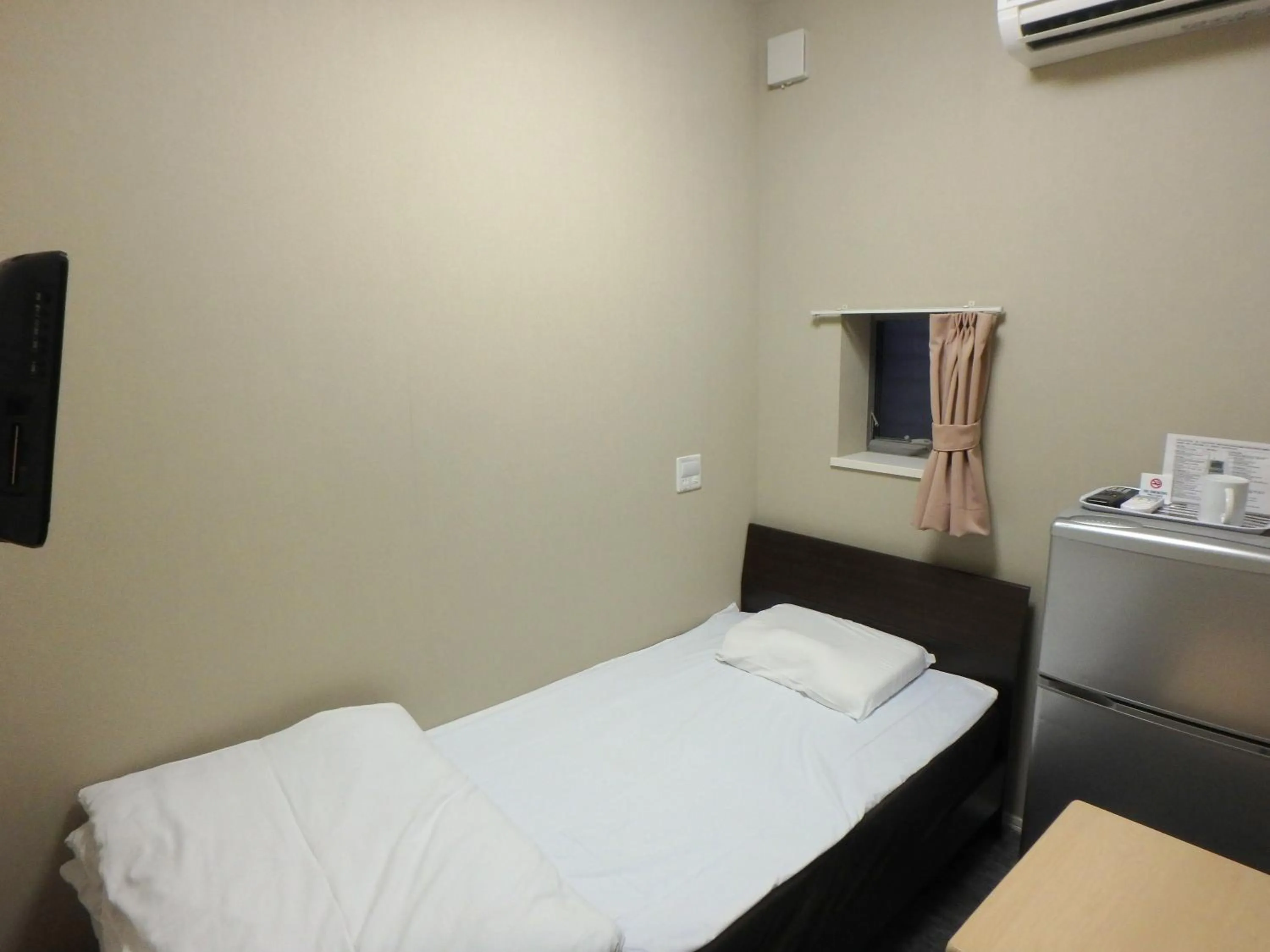 Bed in Economy Hotel Hoteiya