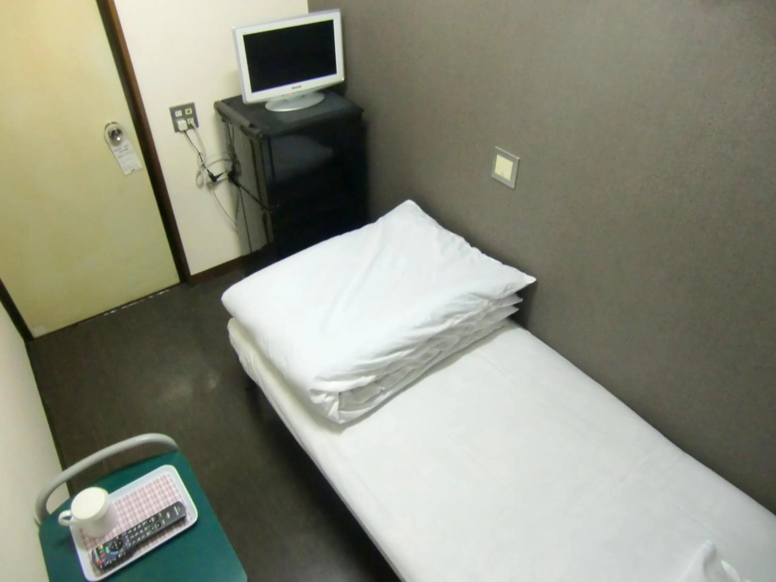 Bed in Economy Hotel Hoteiya