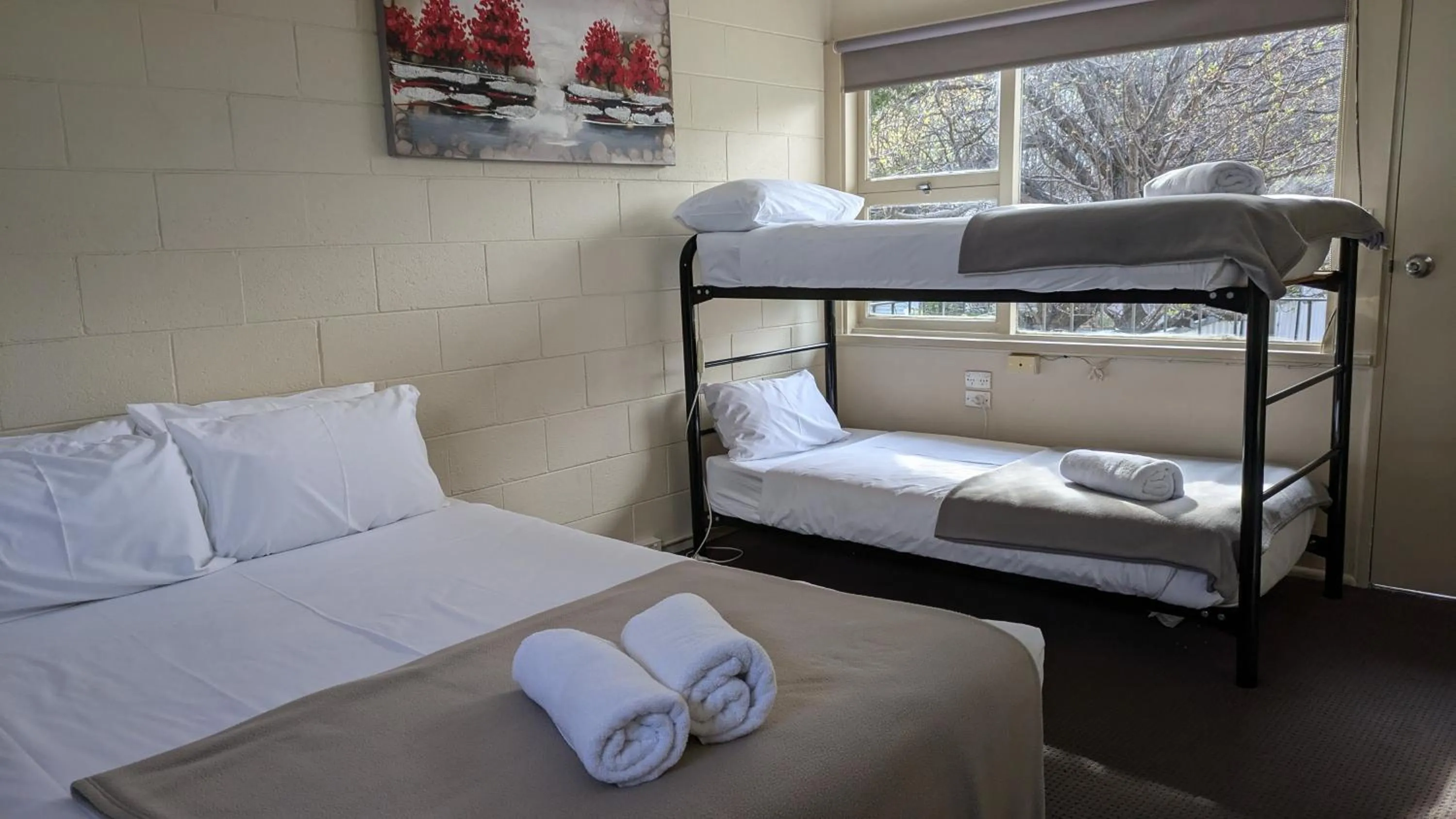 Bed in The Swiss Motel