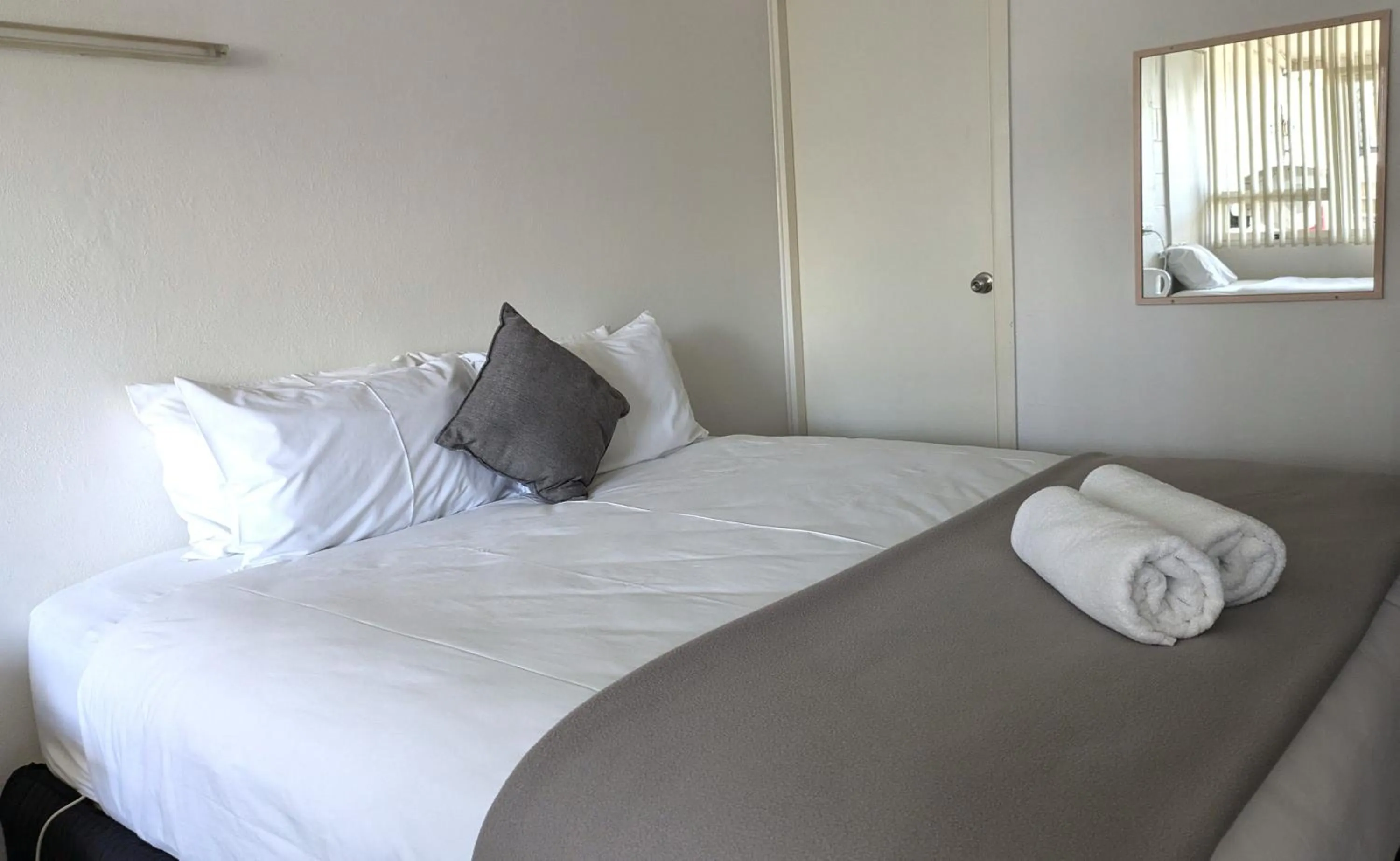 Bed in The Swiss Motel