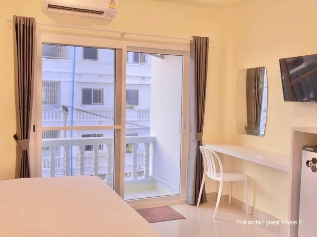 Bed in Thai Orchid Guest House