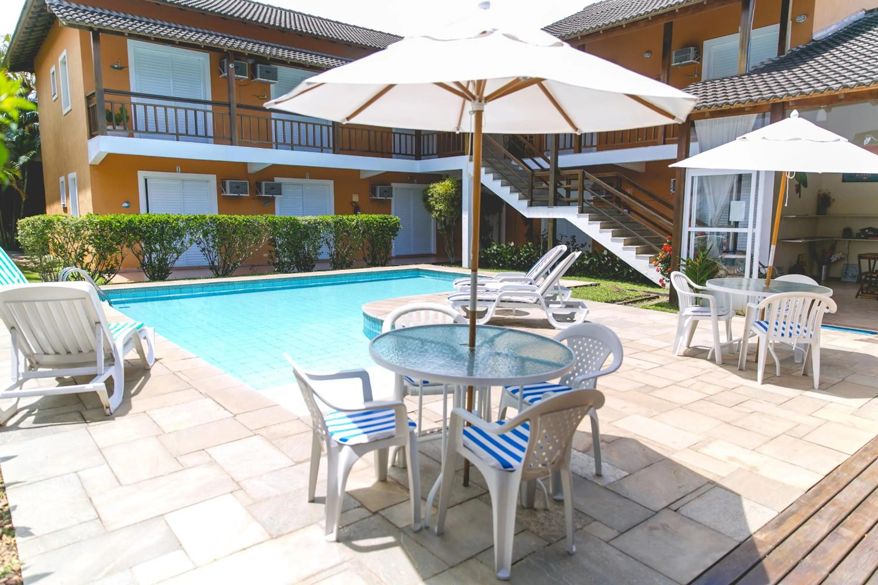 Swimming pool in Pousada Rosa dos Ventos Juquehy