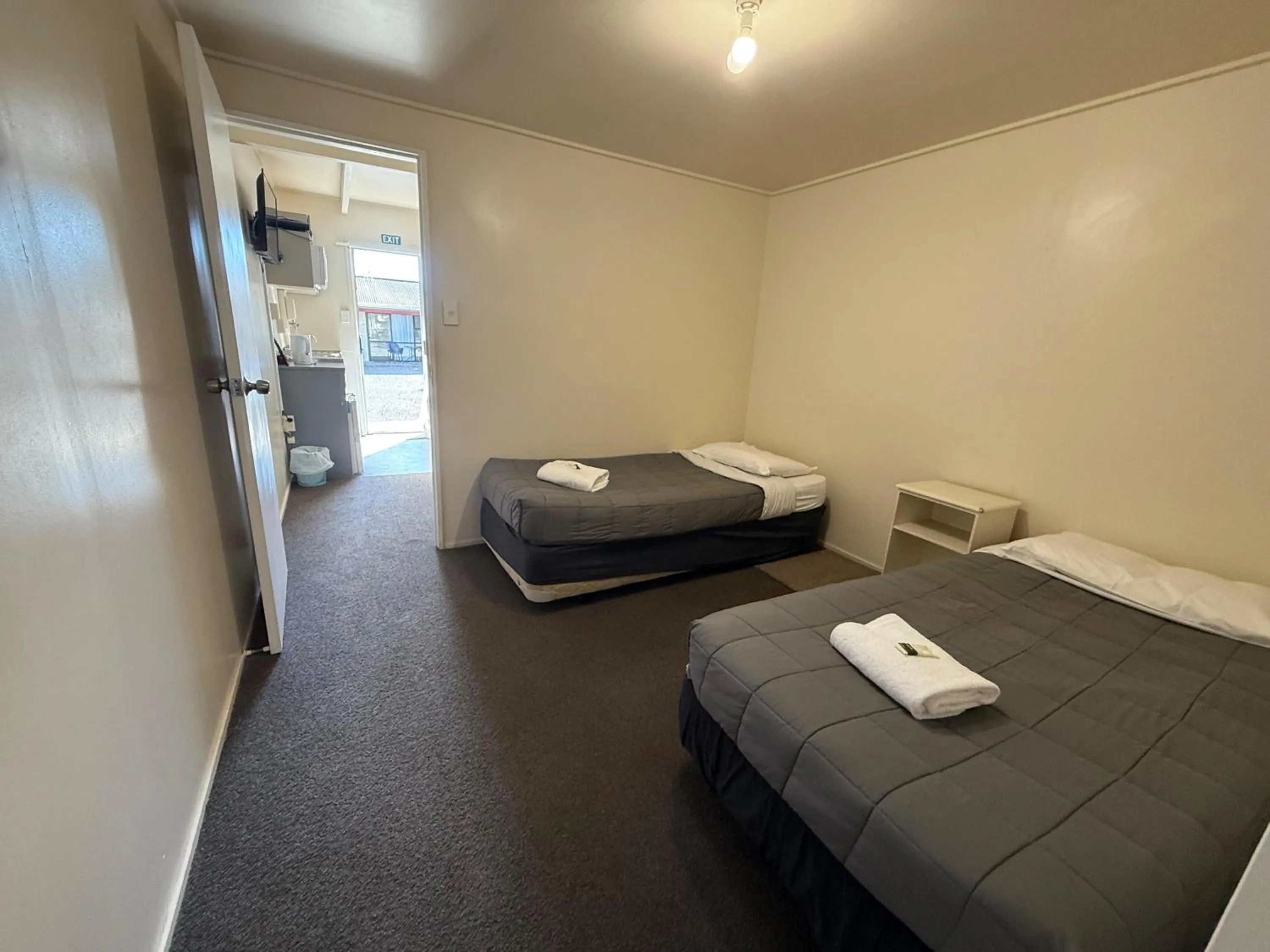 Bed in Camellia Court Family Motel