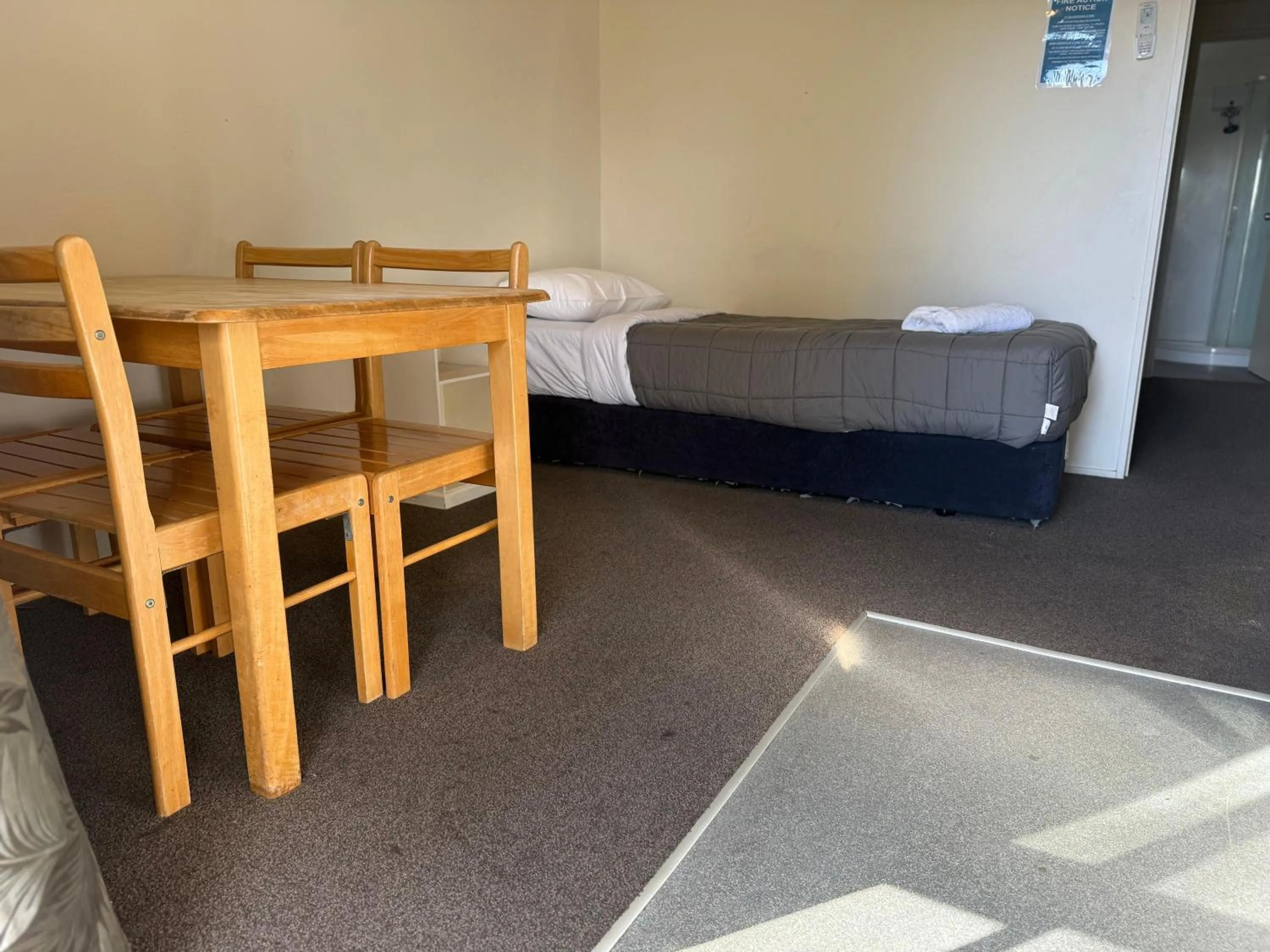 Bed in Camellia Court Family Motel