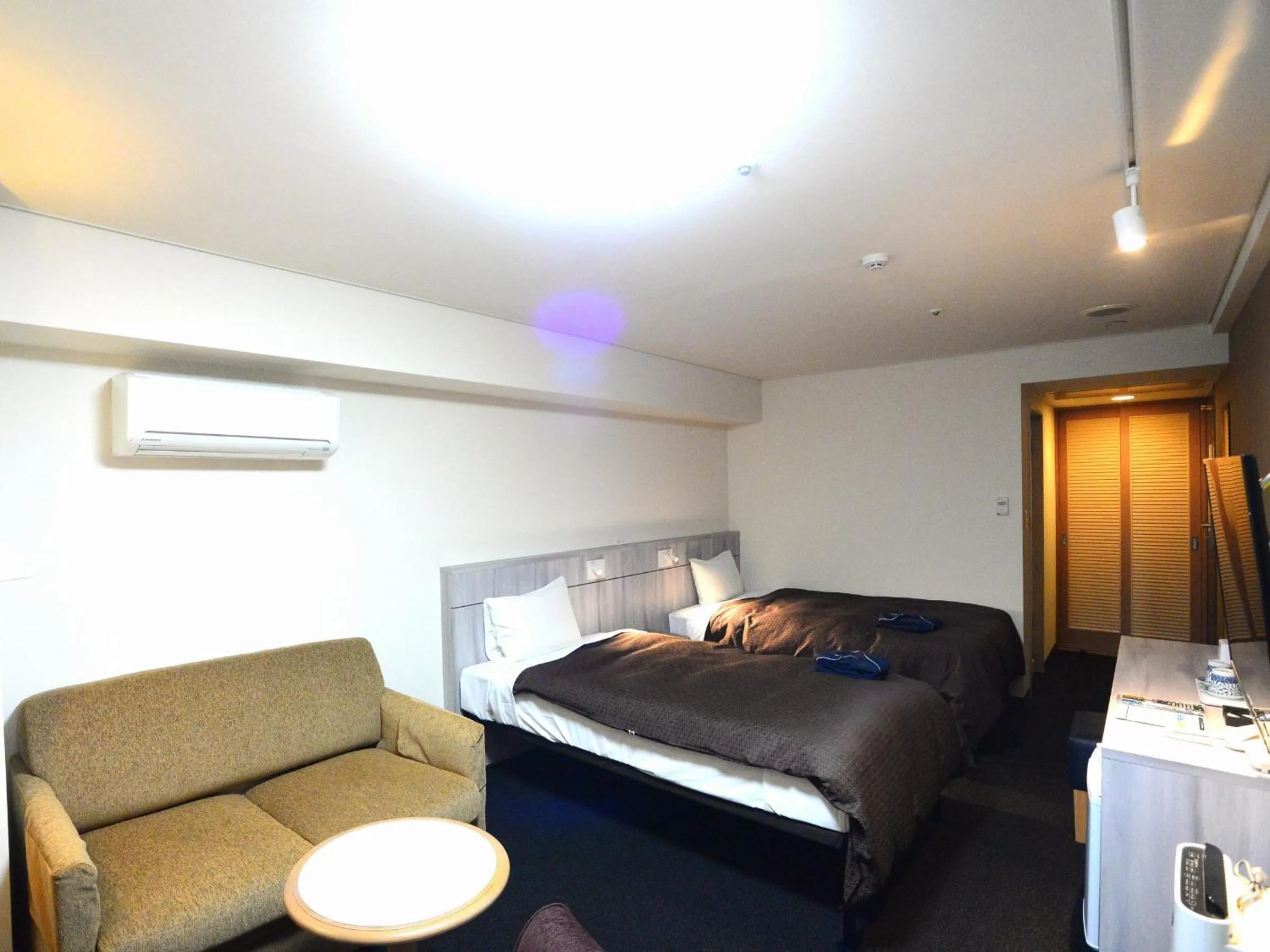 Bed in Sunwest Hotel Sasebo