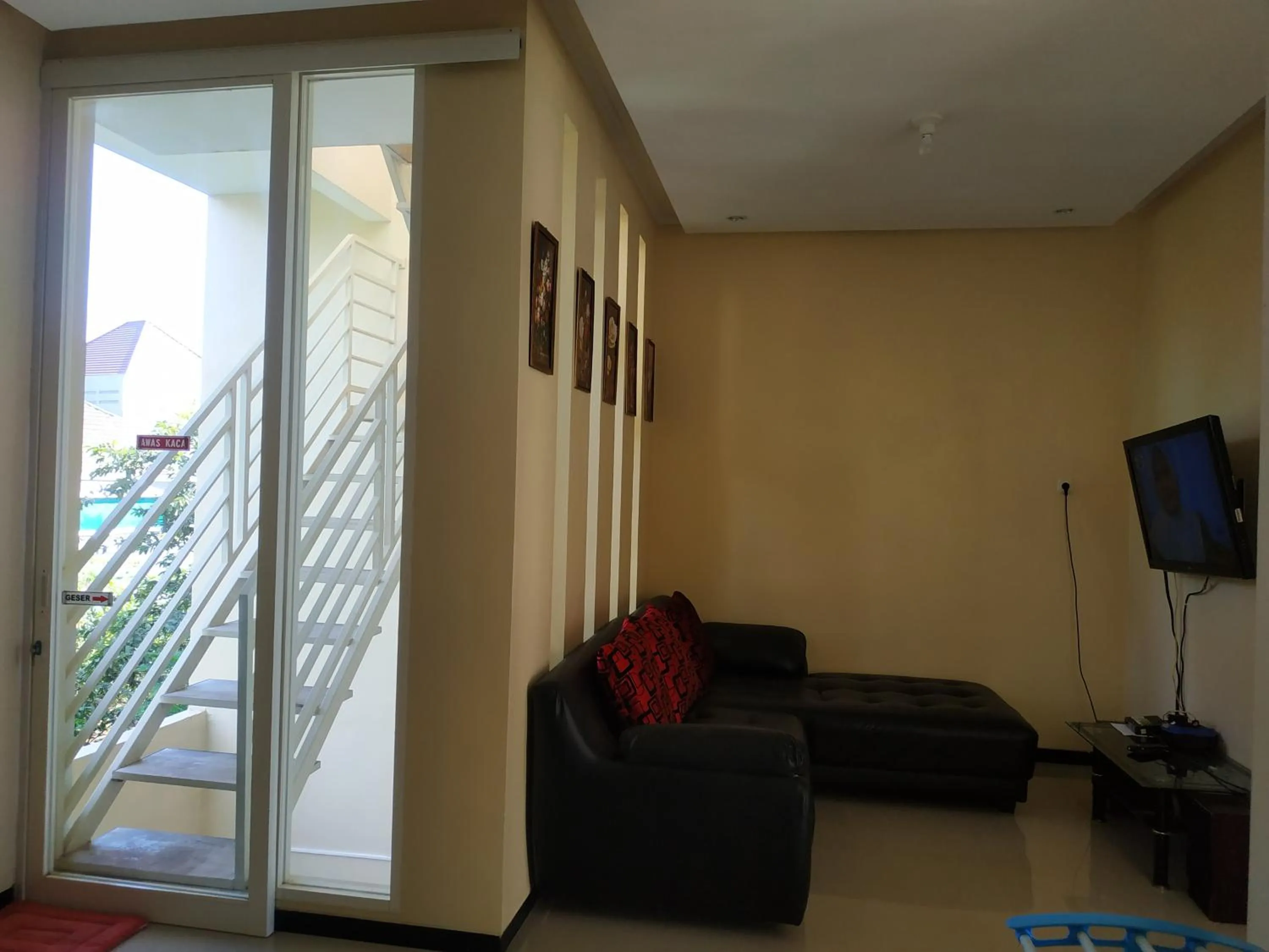 Communal lounge/ TV room in Villa Gumilang