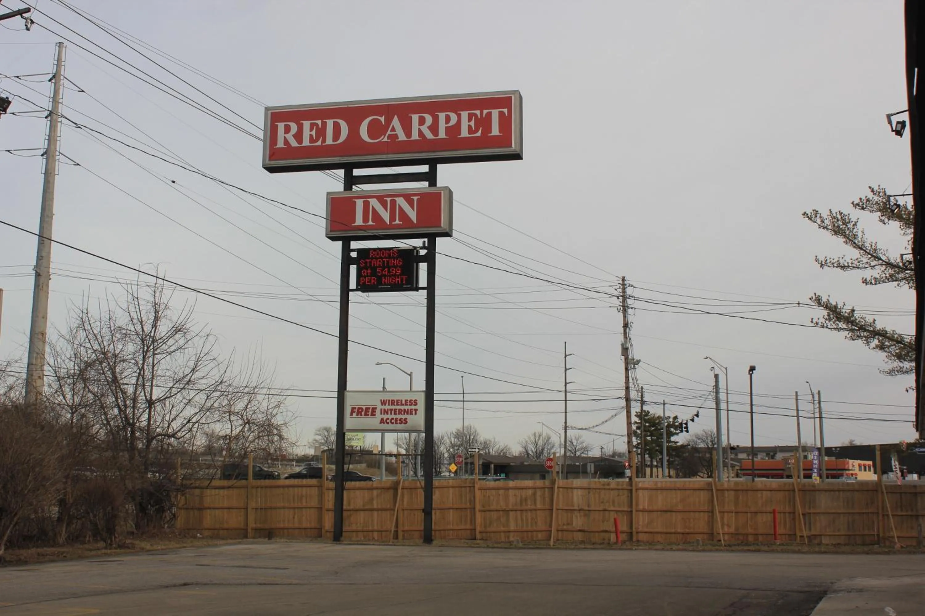 Property logo or sign in Red Carpet Inn - Louisville