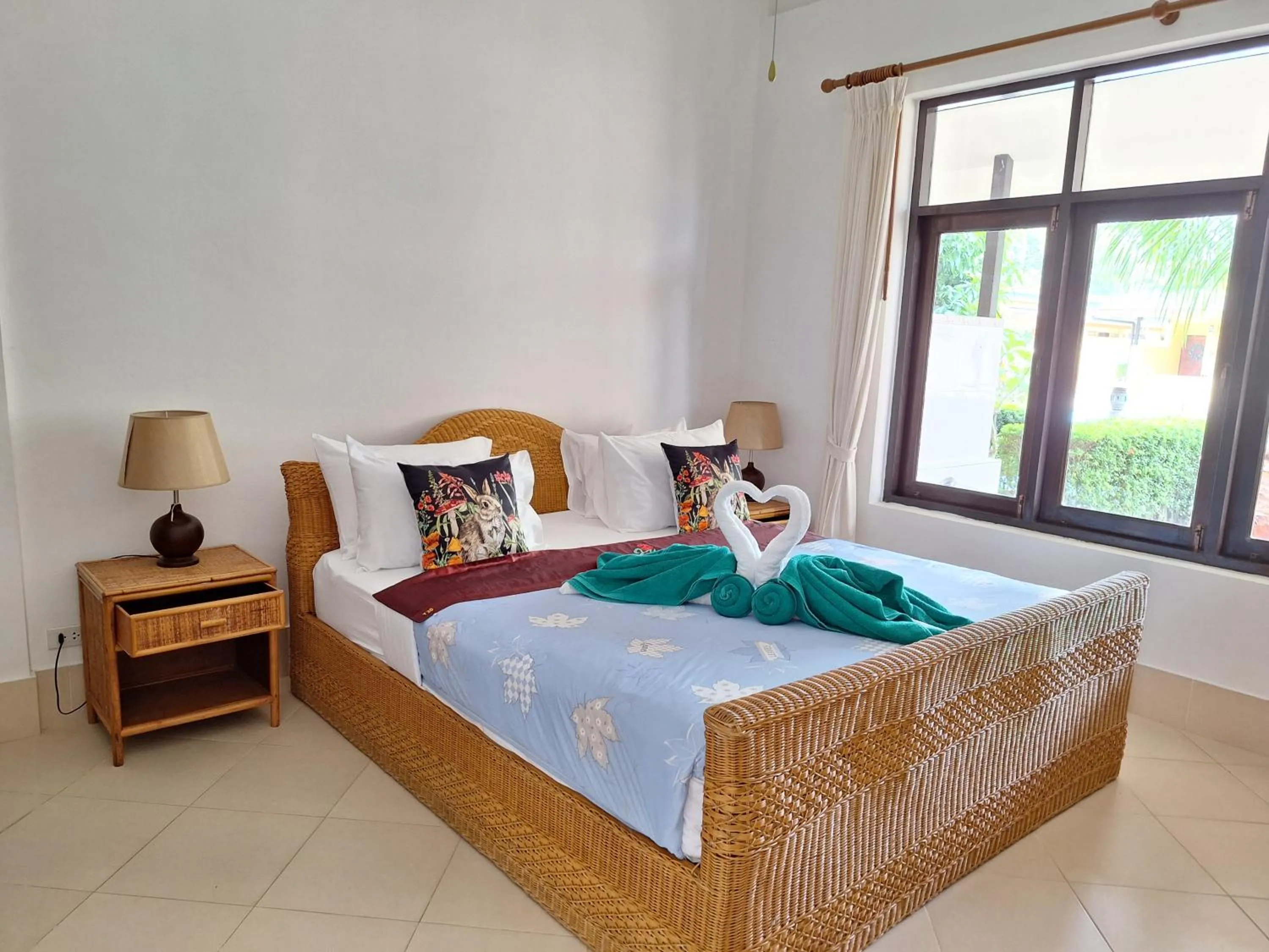 Bed in Jungle Village Bungalow